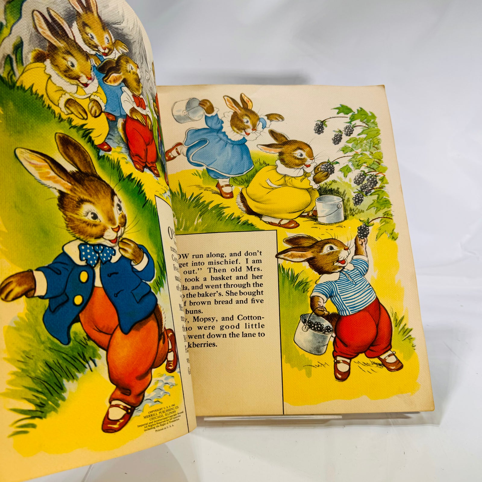 Color spread of Peter and his sisters picking blackberries, The Tale of Peter Rabbit