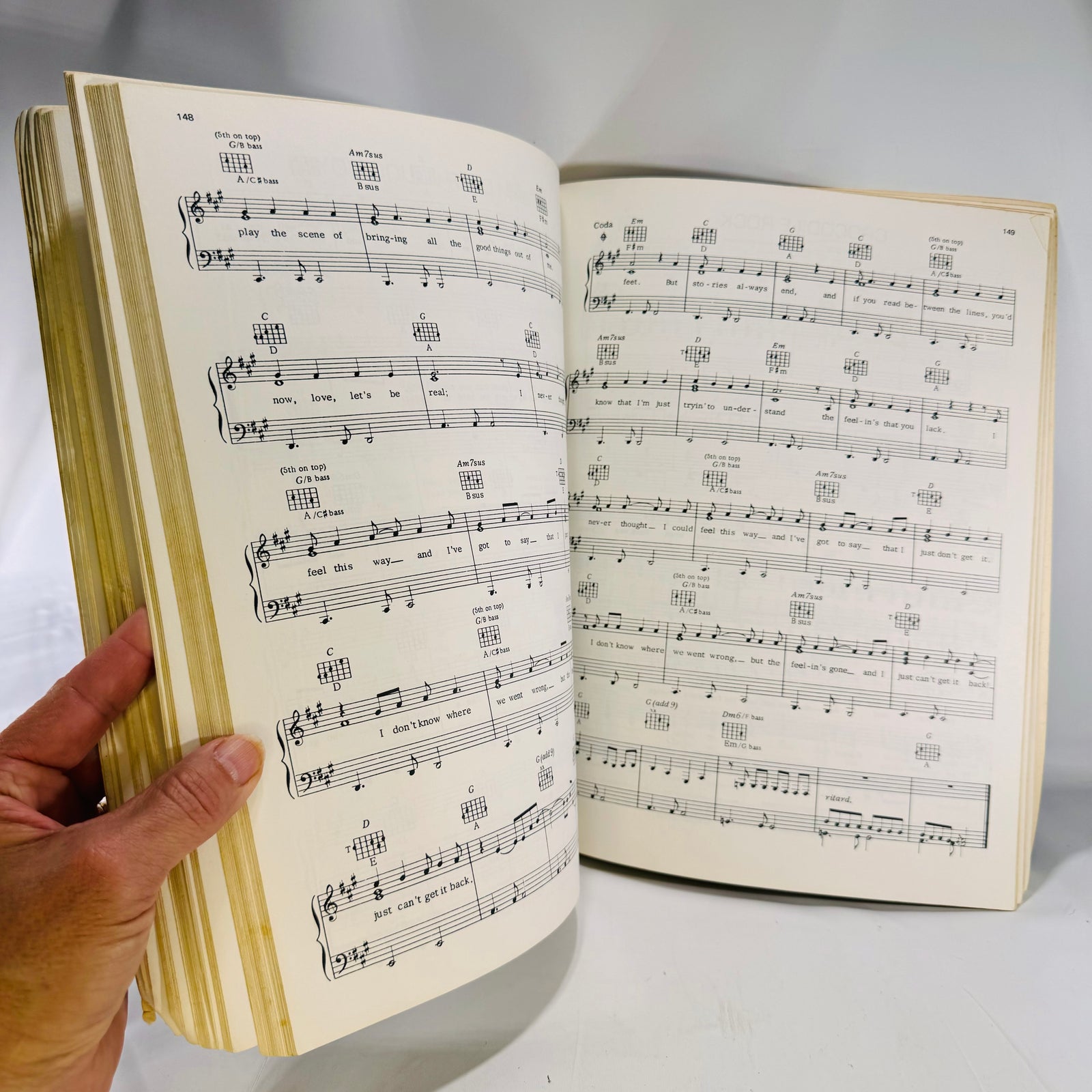 Piano and vocal sheet music pages with chord frames, rock songbook 1996