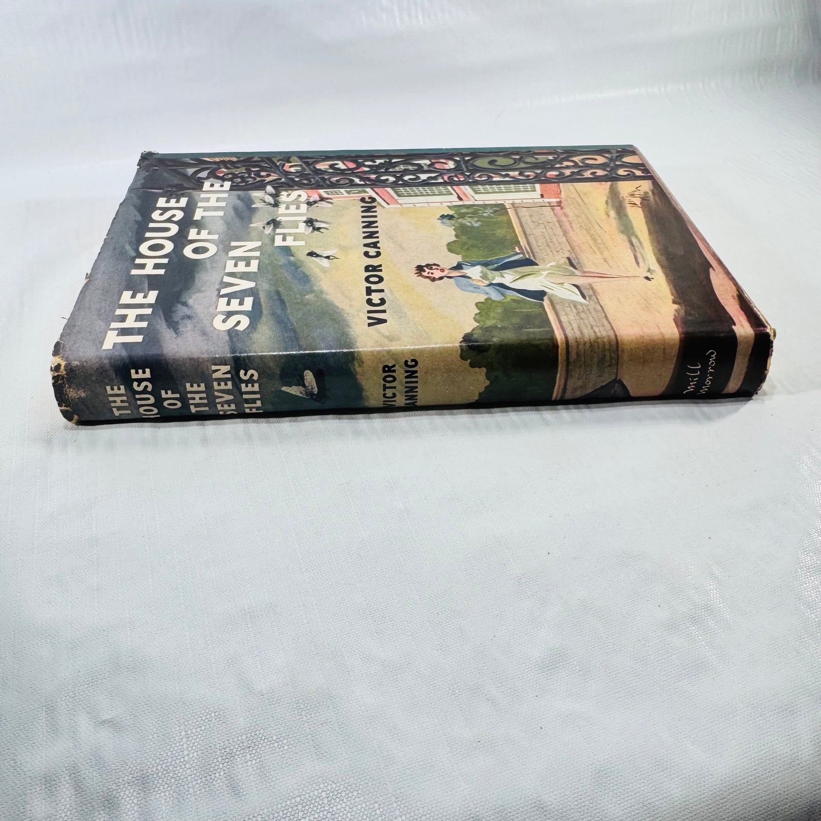 Dust jacket spine with wear at ends