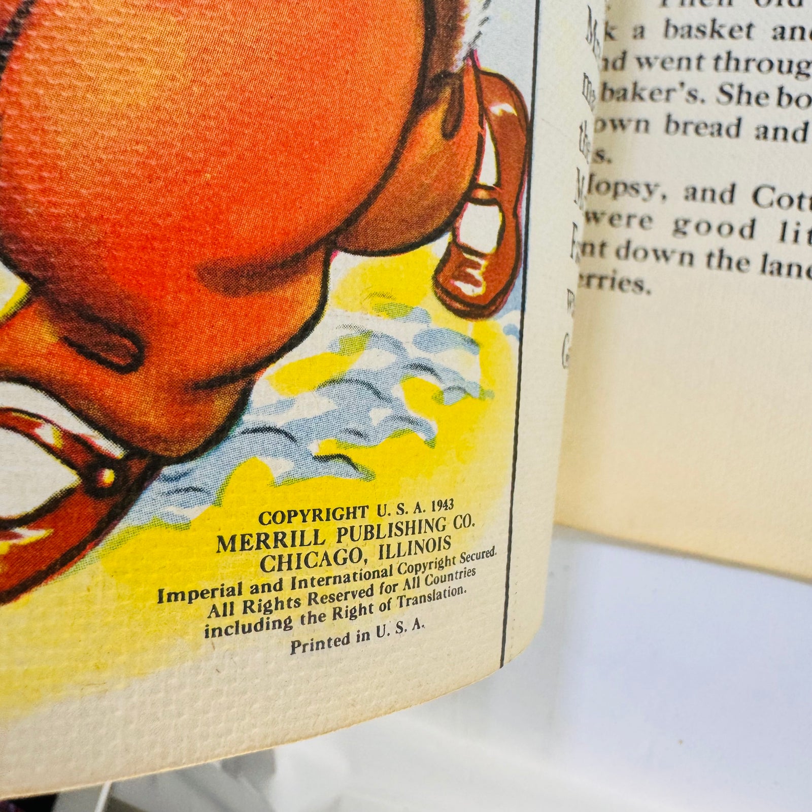 Close-up of the Copyright U.S.A. 1943 Merrill Publishing notice and linen texture