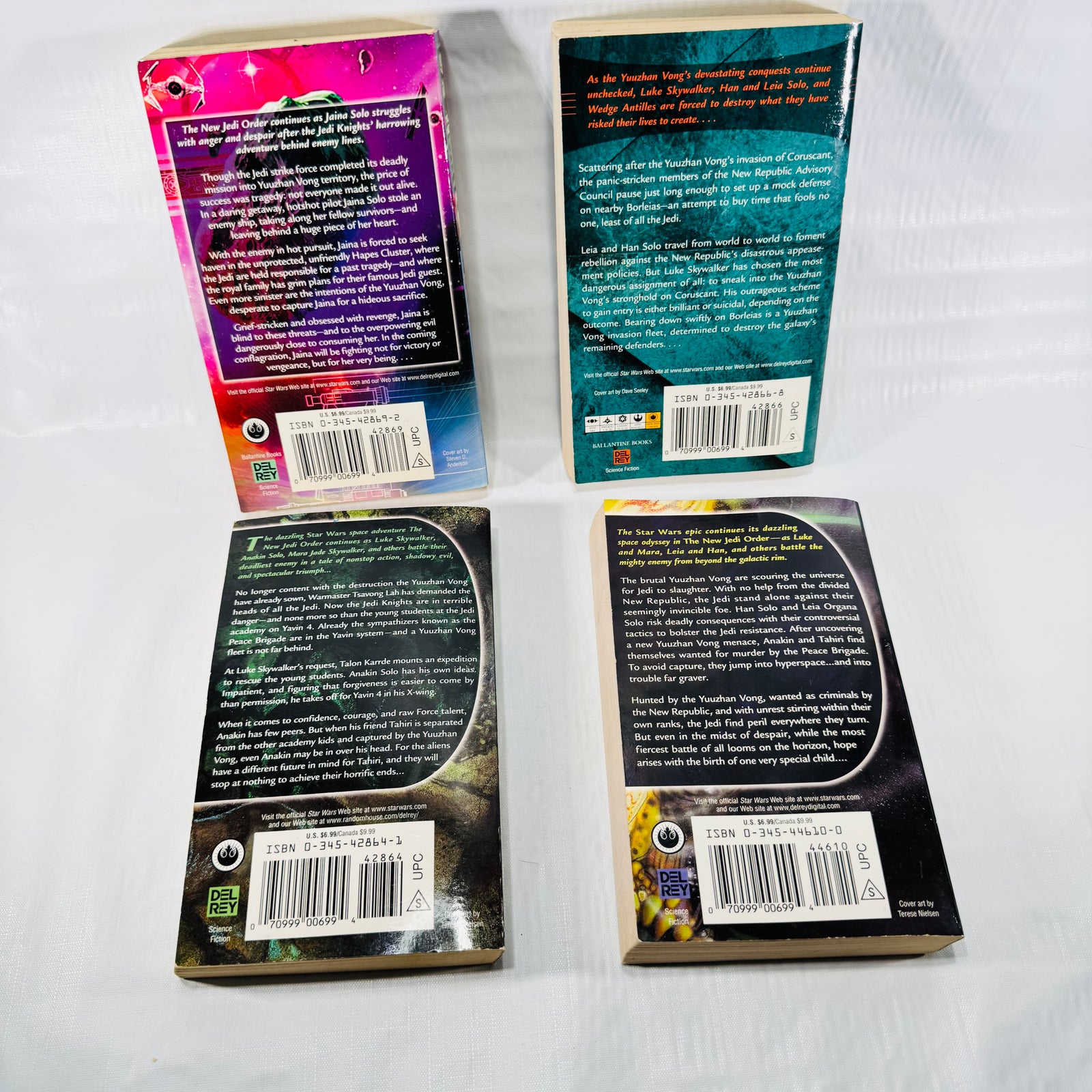 Four back covers with ISBN numbers