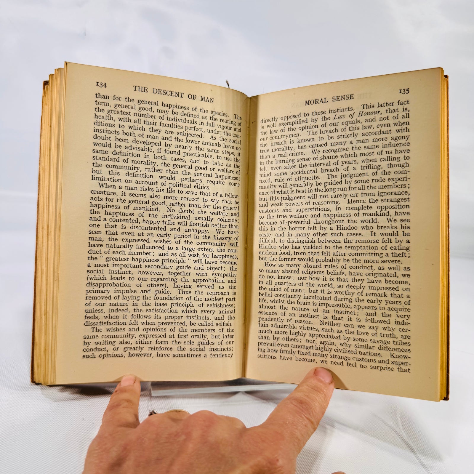 The Descent of Man 1930 open to Moral Sense, pages 134 and 135