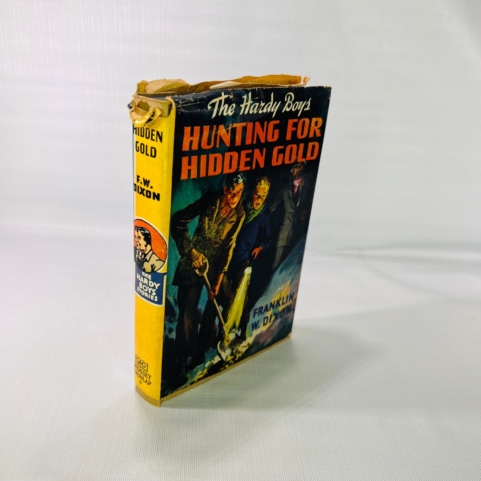 The Hardy Boys Hunting for Hidden Gold 1928, front of the pictorial dust jacket