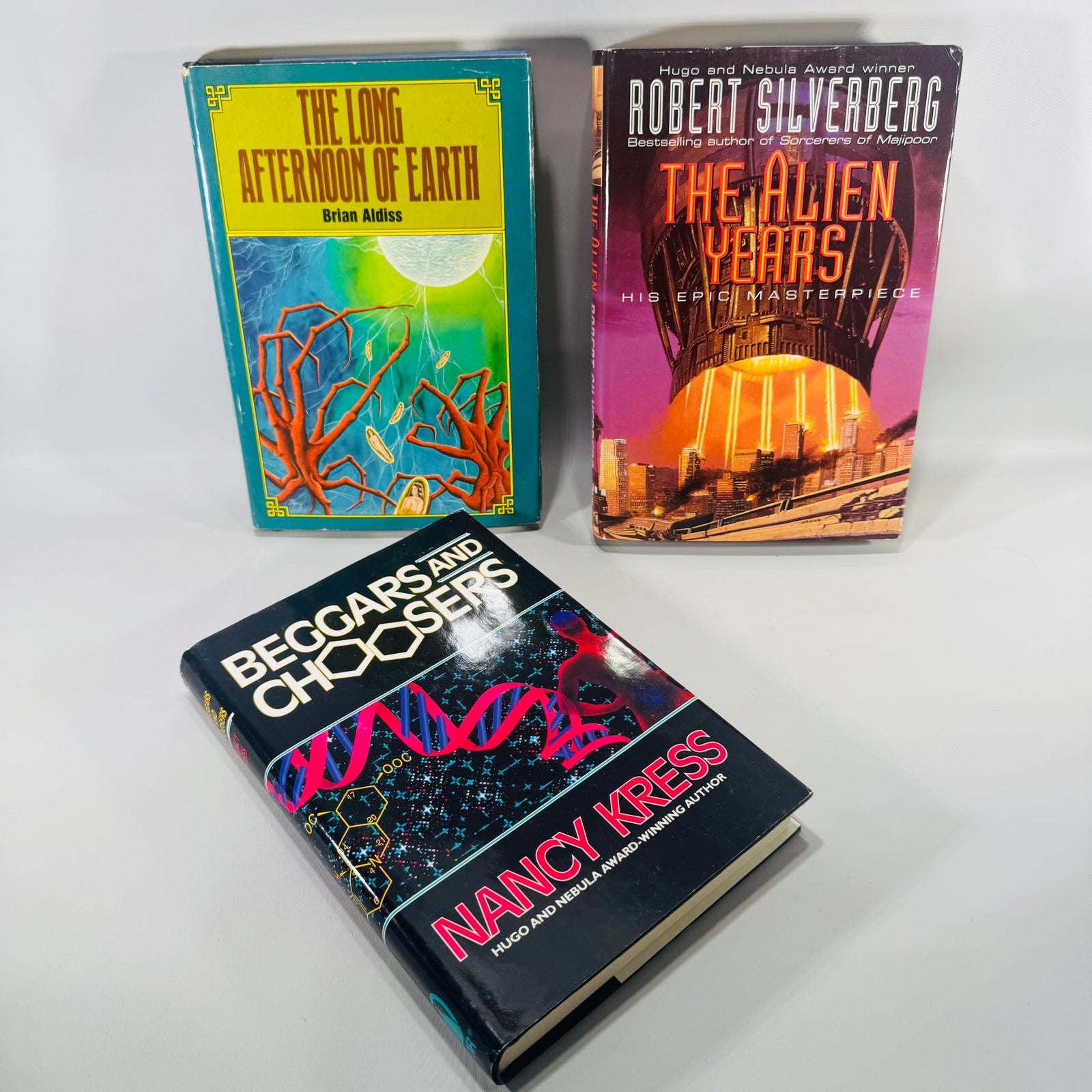 Three books titled 'The Long Afternoon of Earth', 'Beggars and Choosers', and 'The Alien Years'