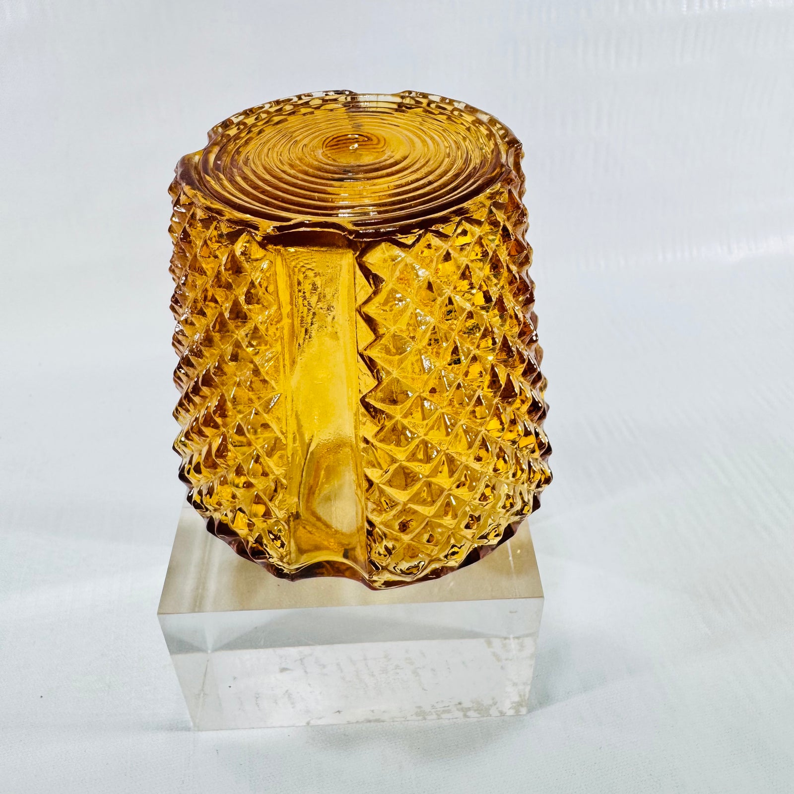 Amber diamond point glass shade upside down showing a smooth corner panel