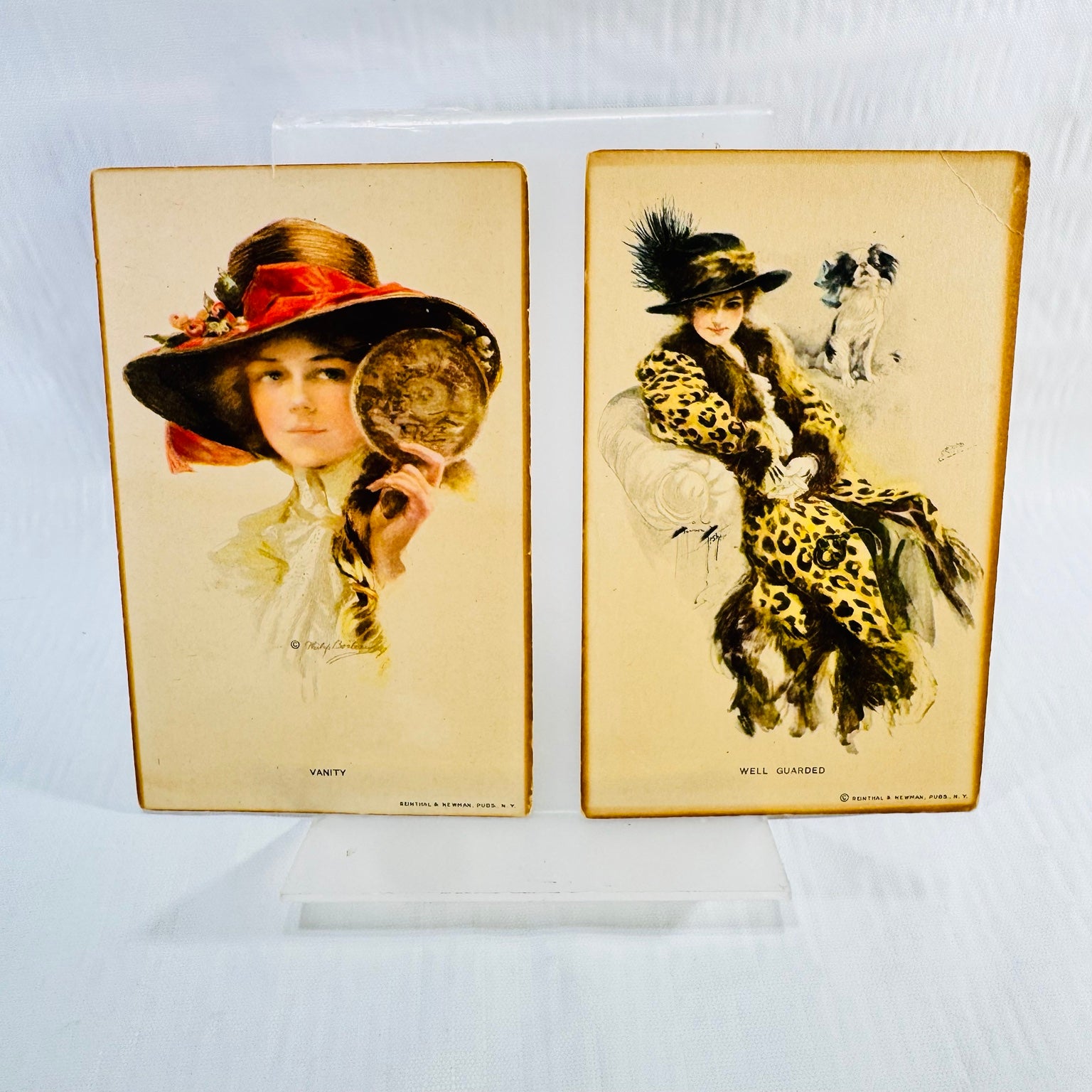 Vanity by Philip Boileau and Well Guarded by Harrison Fisher postcard fronts