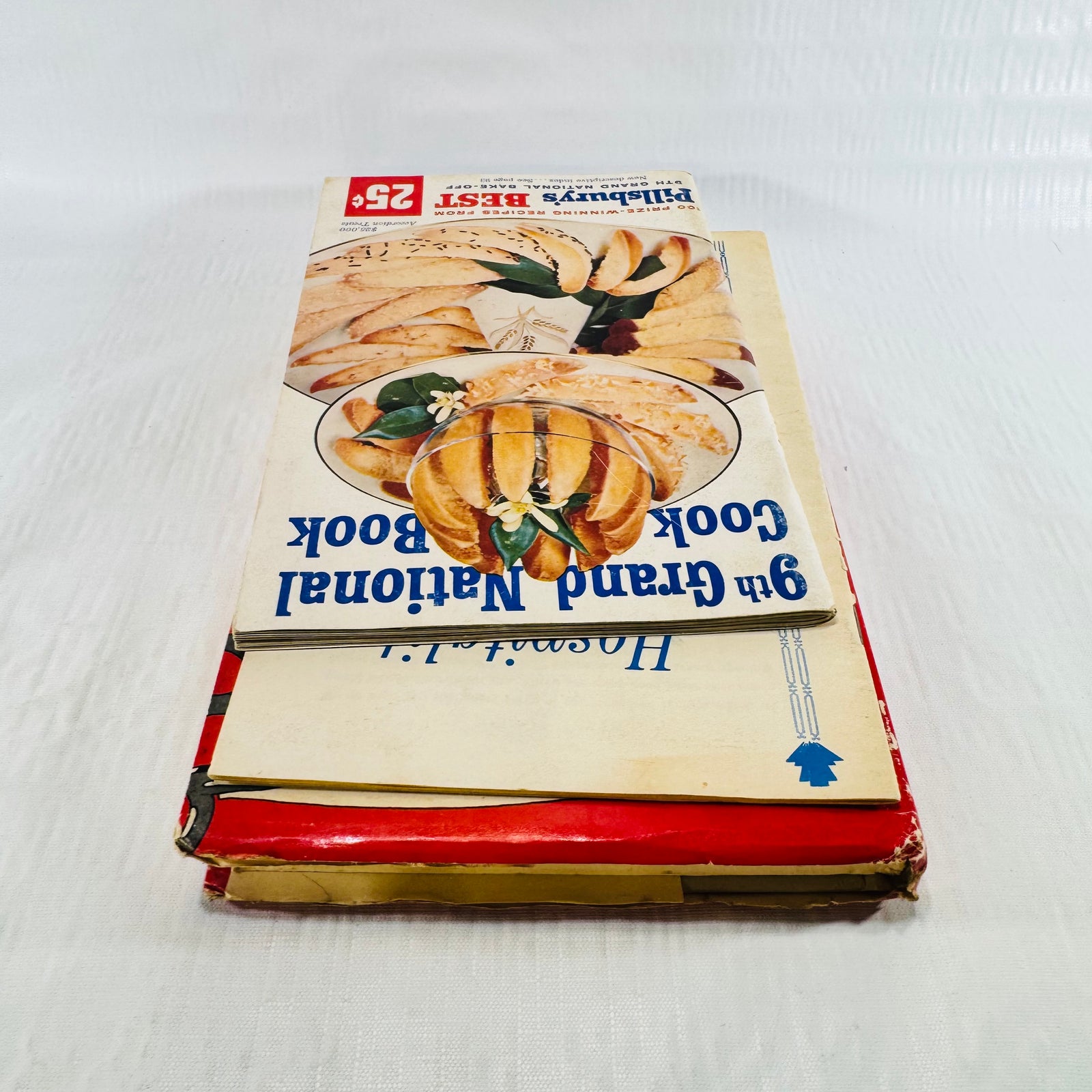 Stack with the Pillsbury booklet upside down above the worn Dyer jacket