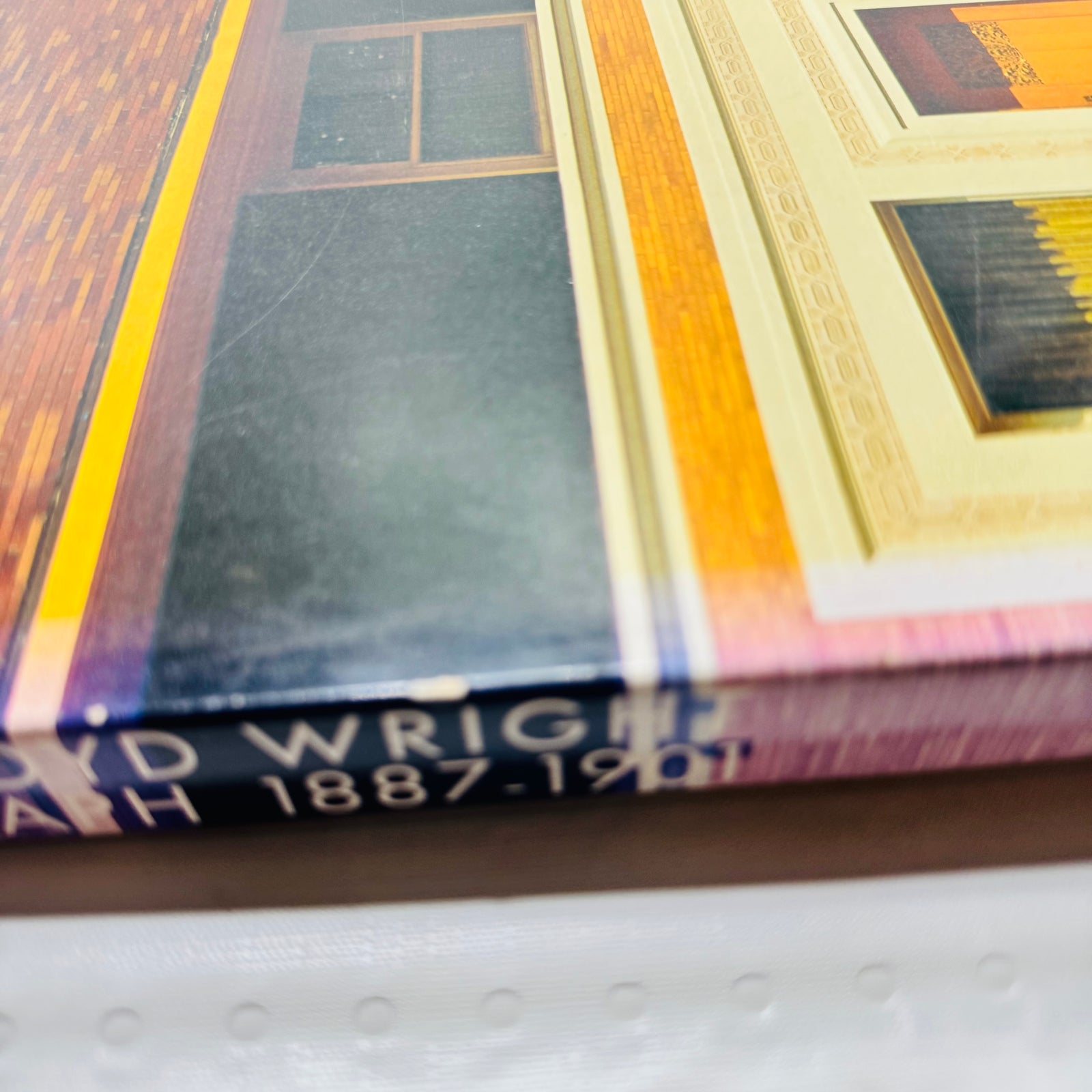 Close-up of light spine wear and small chips on the Frank Lloyd Wright Monograph