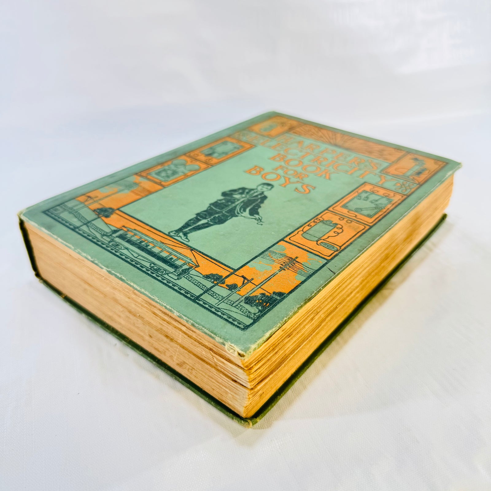 Angled front view of the antique 1907 Harper's Electricity Book for Boys