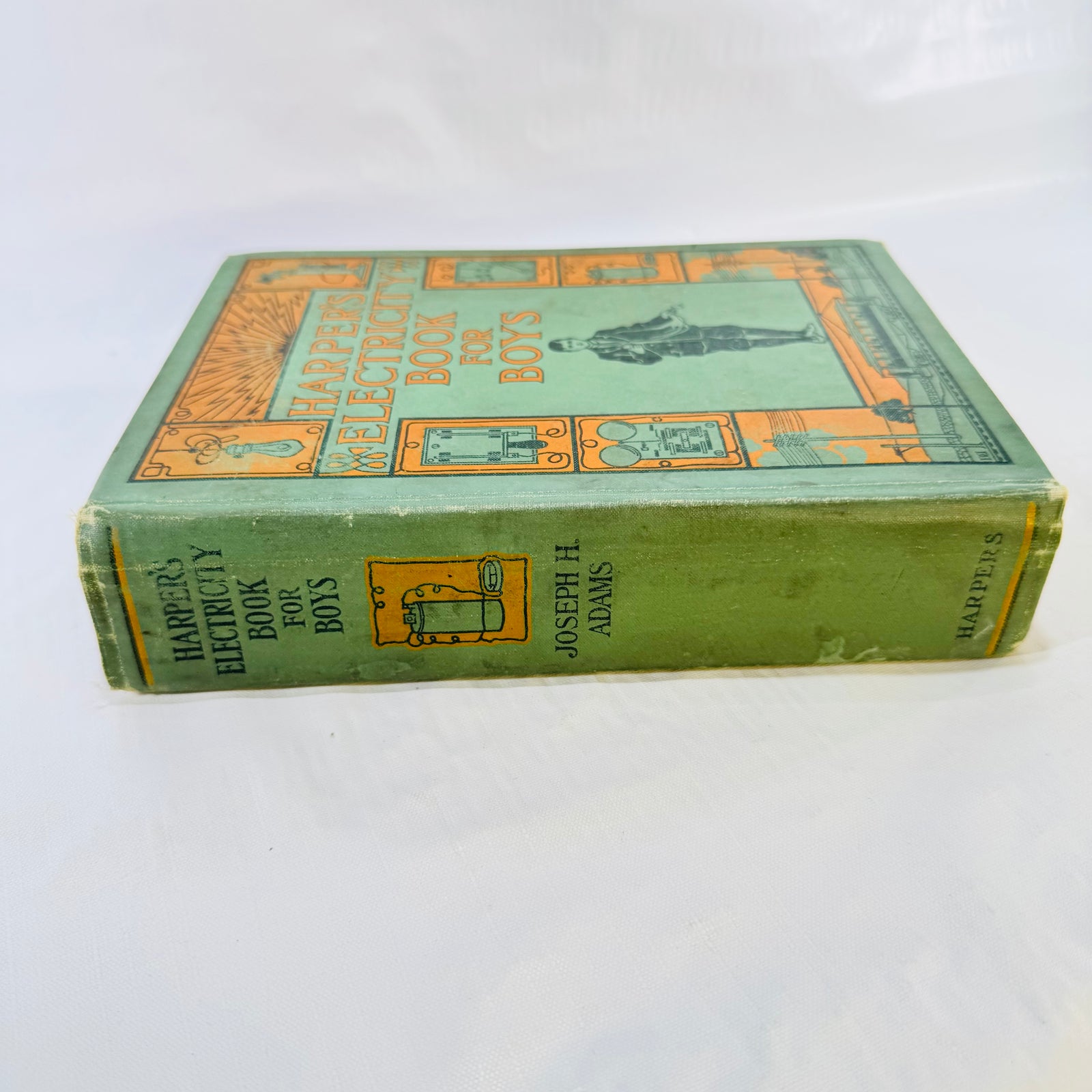 Spine of Harper's Electricity Book for Boys with worn ends