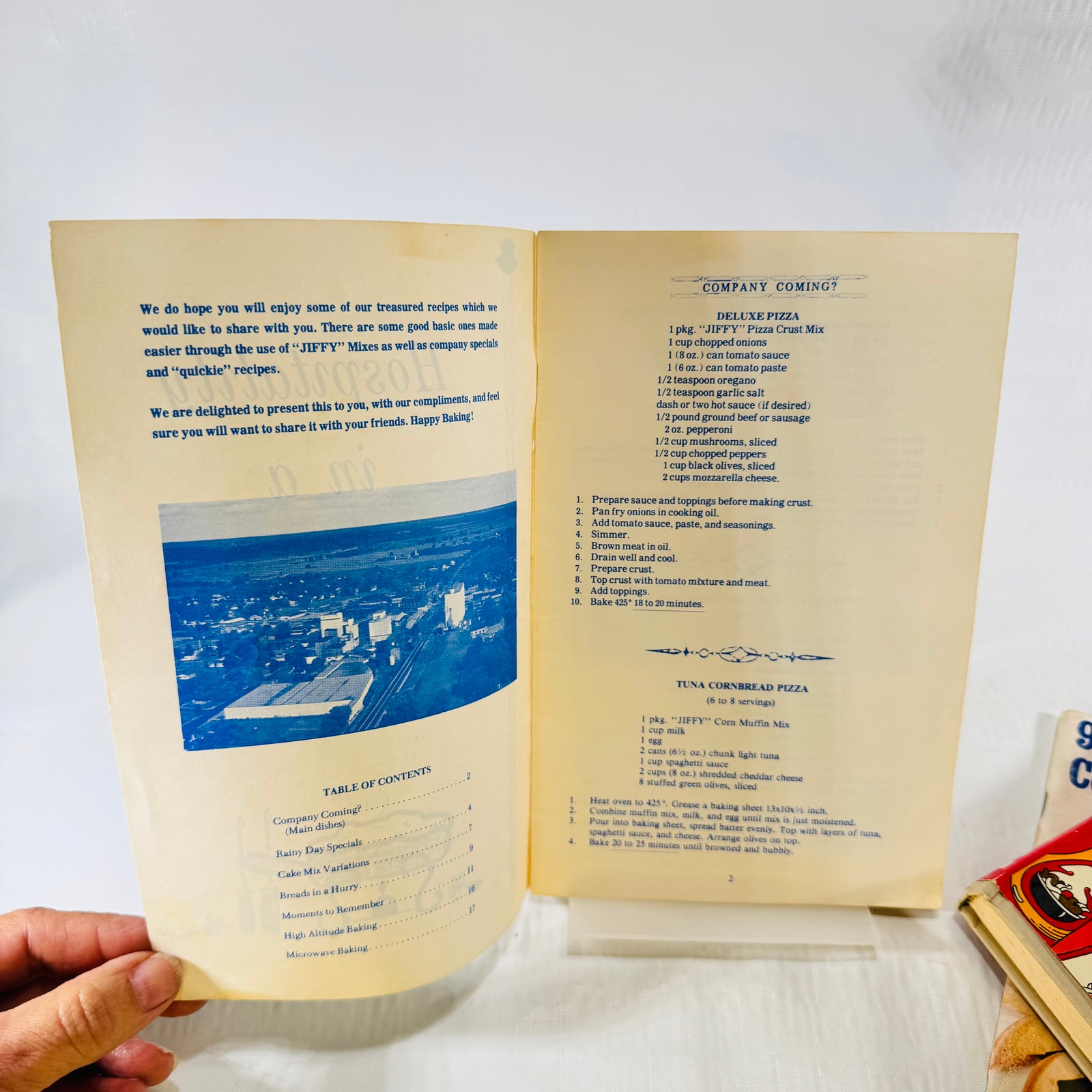 Overhead view of the Jiffy welcome note, contents list, and two pizza recipes