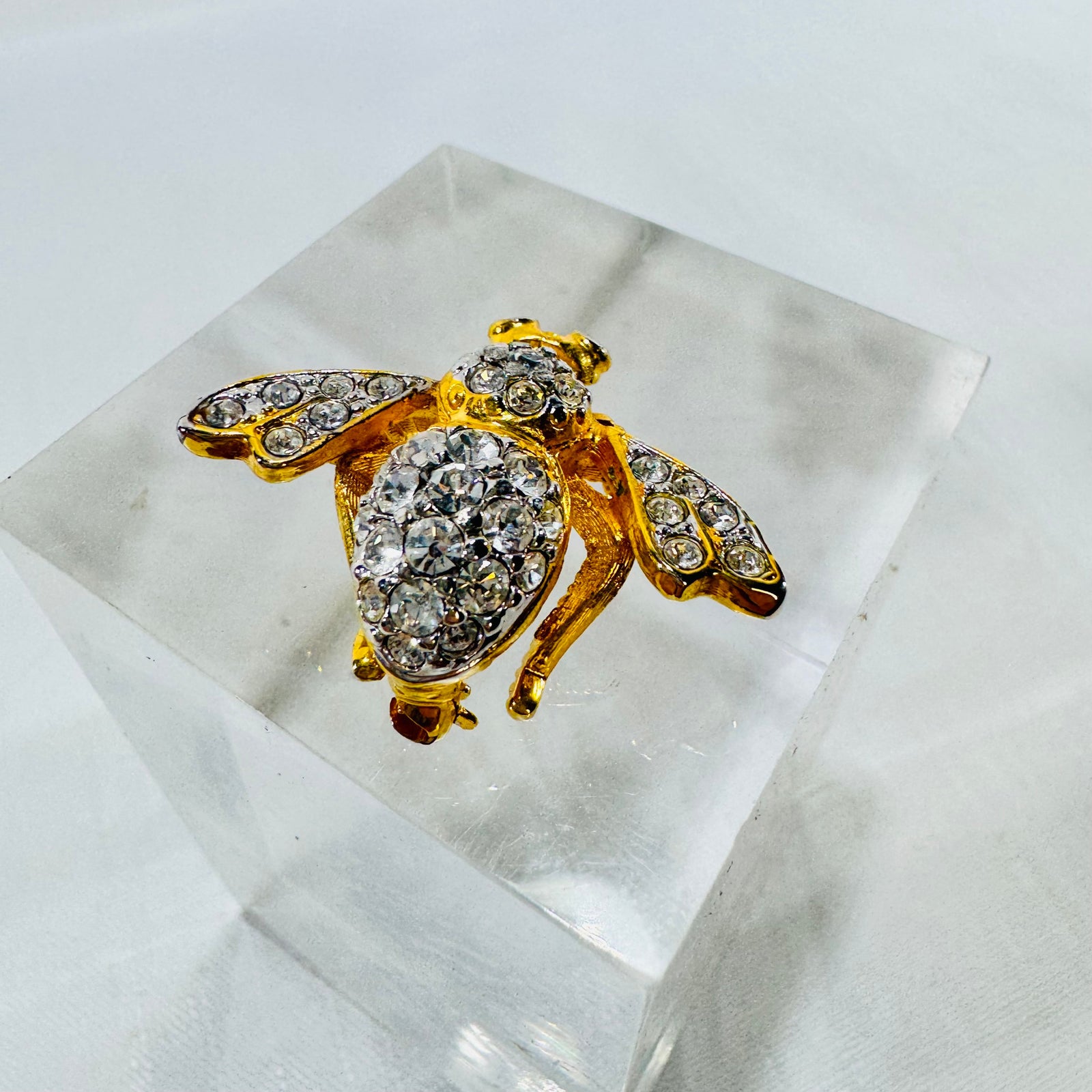 Raised rhinestone body and wings of Joan Rivers bee pin