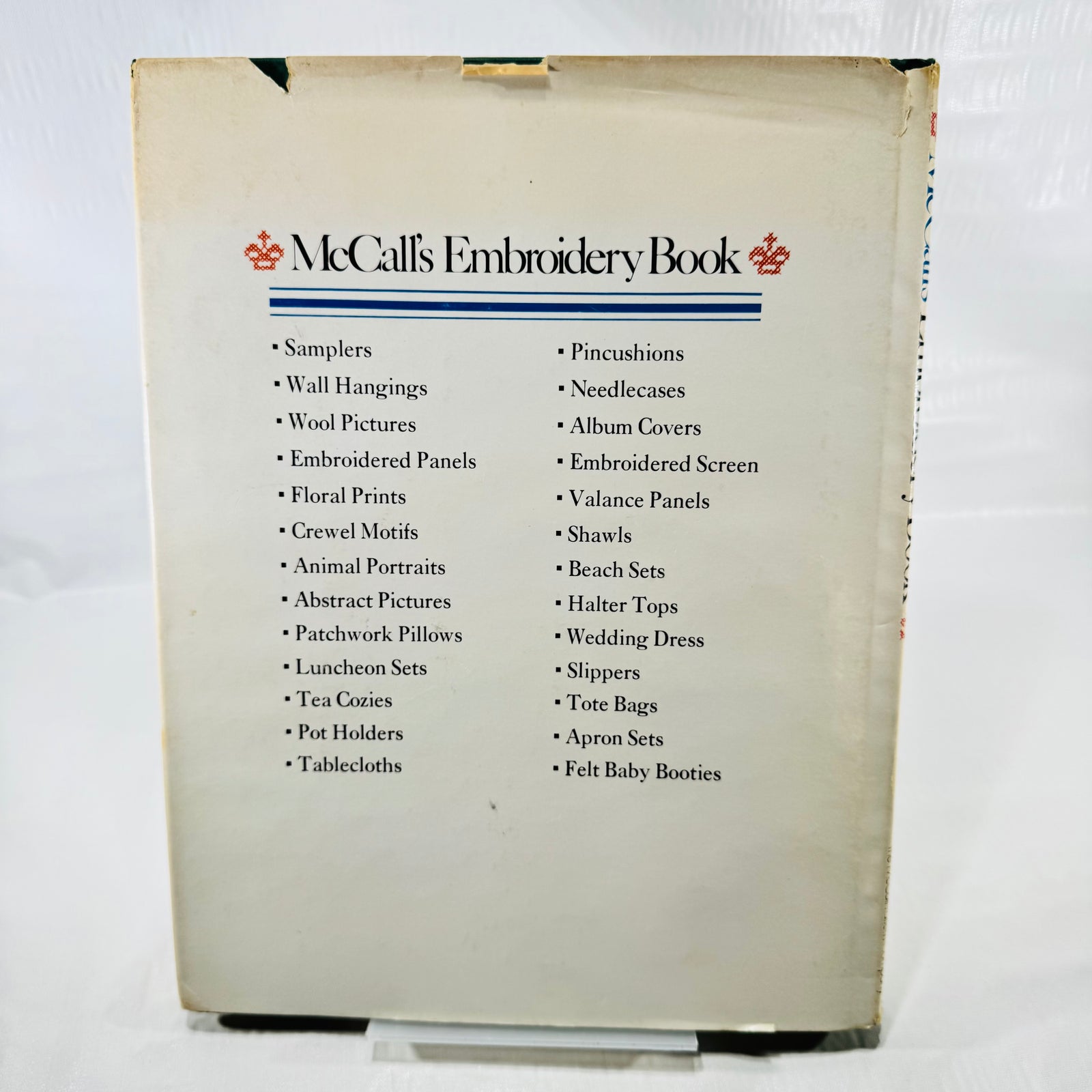 McCall's Embroidery Book back dust jacket listing samplers, tablecloths and more projects