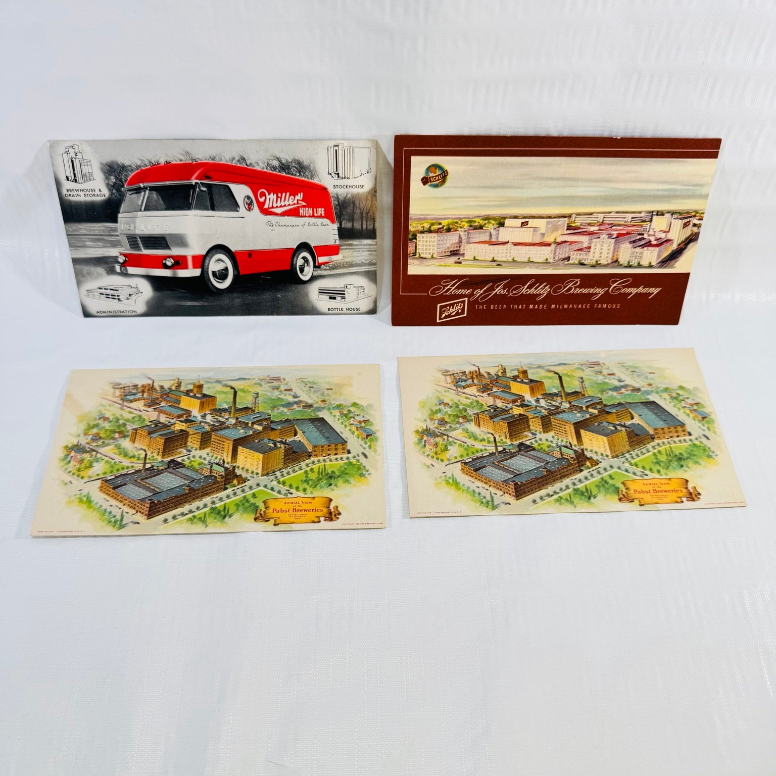 Four vintage Miller, Schlitz and Pabst brewery postcards, including two matching Pabst aerial views