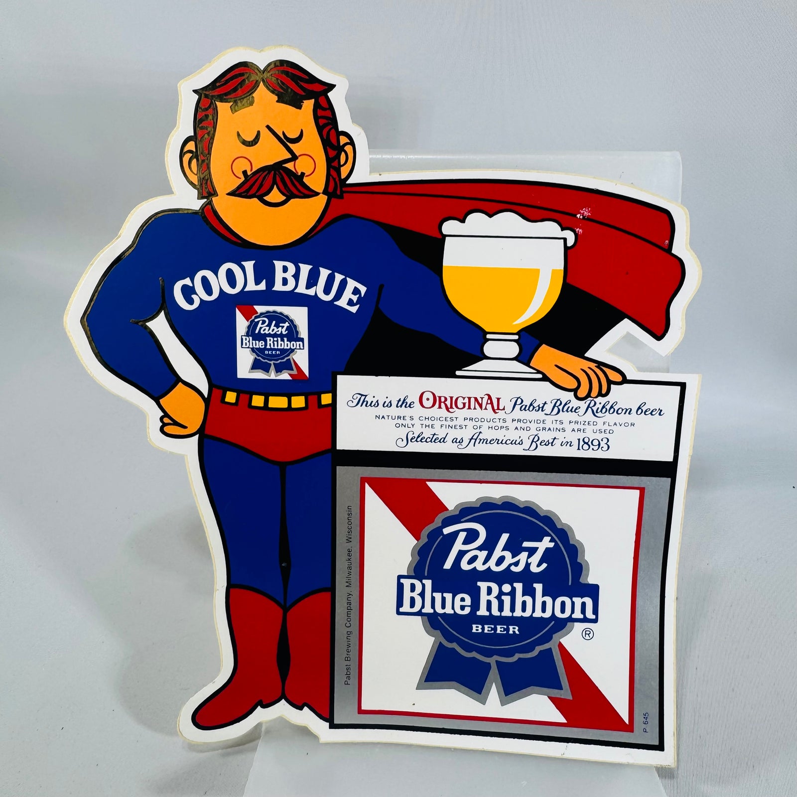 Vintage Pabst Blue Ribbon "Cool Blue" Superhero Die-Cut sticker — PBR Breweriana Advertising Display, Pabst Brewing Company Milwaukee Wisconsin