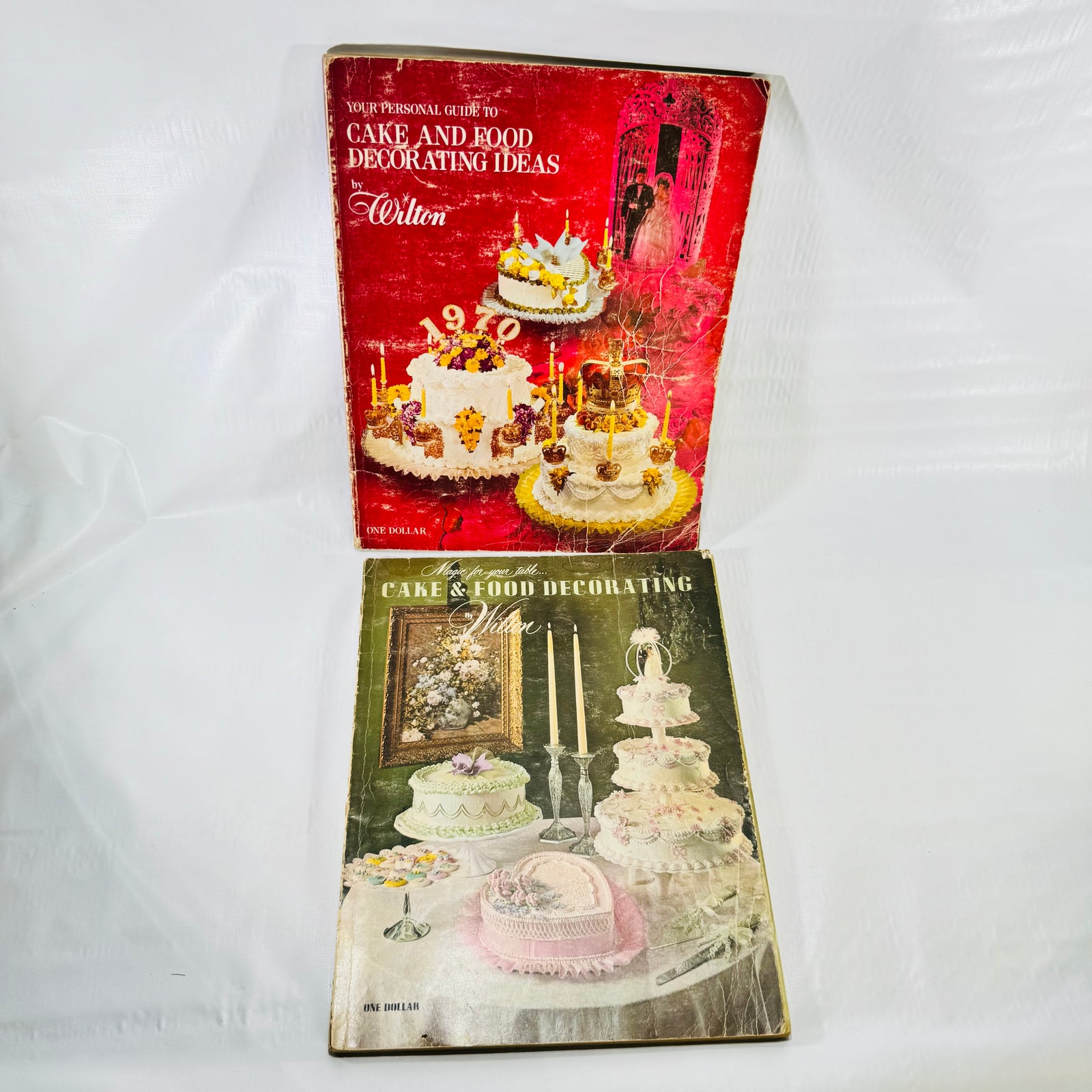 Two vintage Wilton cake decorating books, red 1969 and green 1970-71 front covers