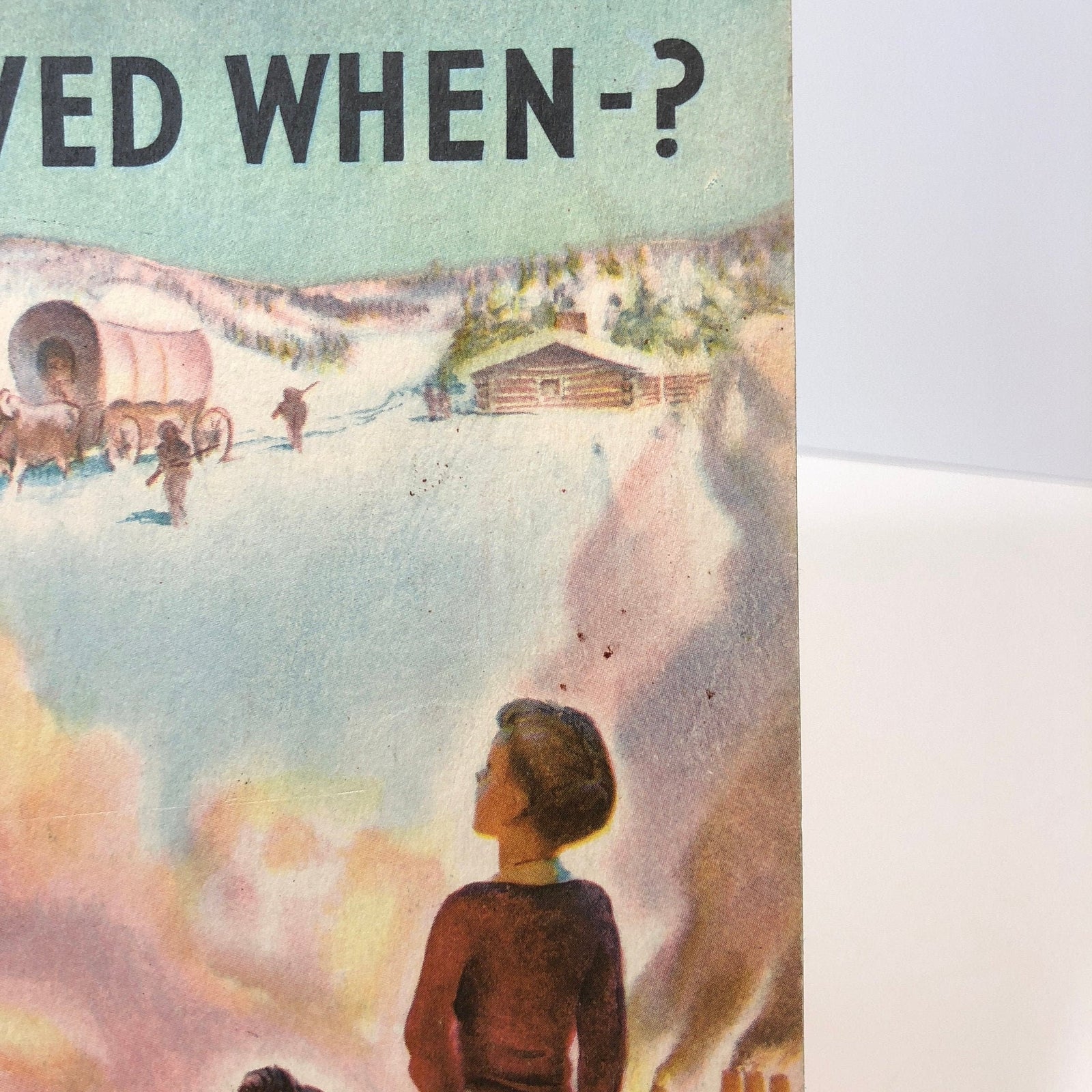 Close view of the covered wagon and log cabin cover art, National Wildlife booklet 1953