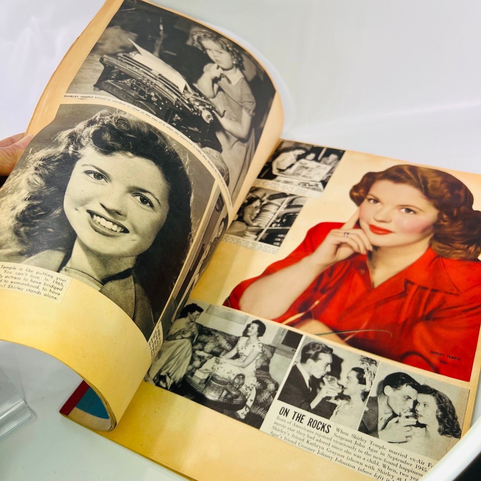 Shirley Temple scrapbook spread with a red blouse portrait and On the Rocks clipping