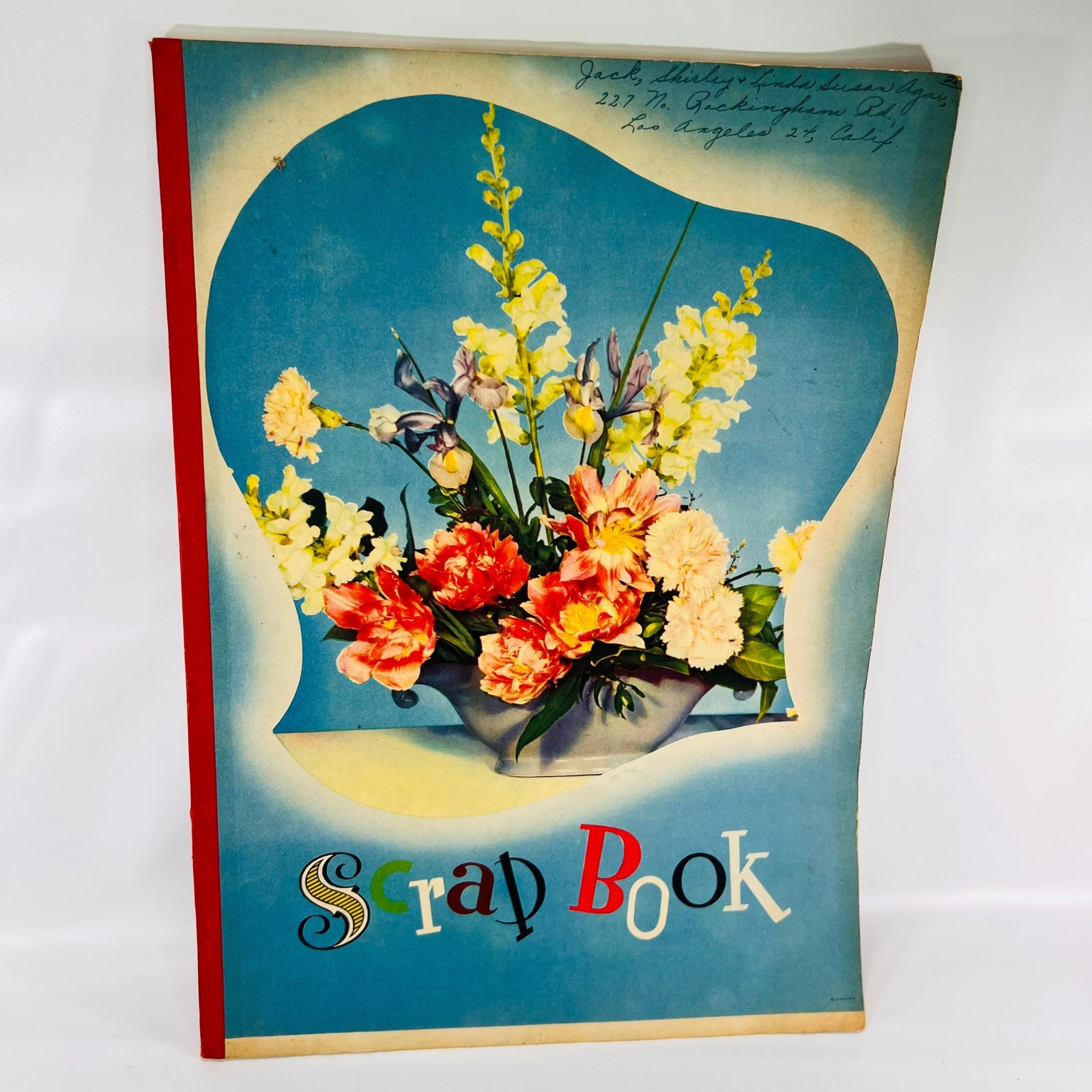 Front cover of the handmade Shirley Temple Scrap Book with a flower bouquet