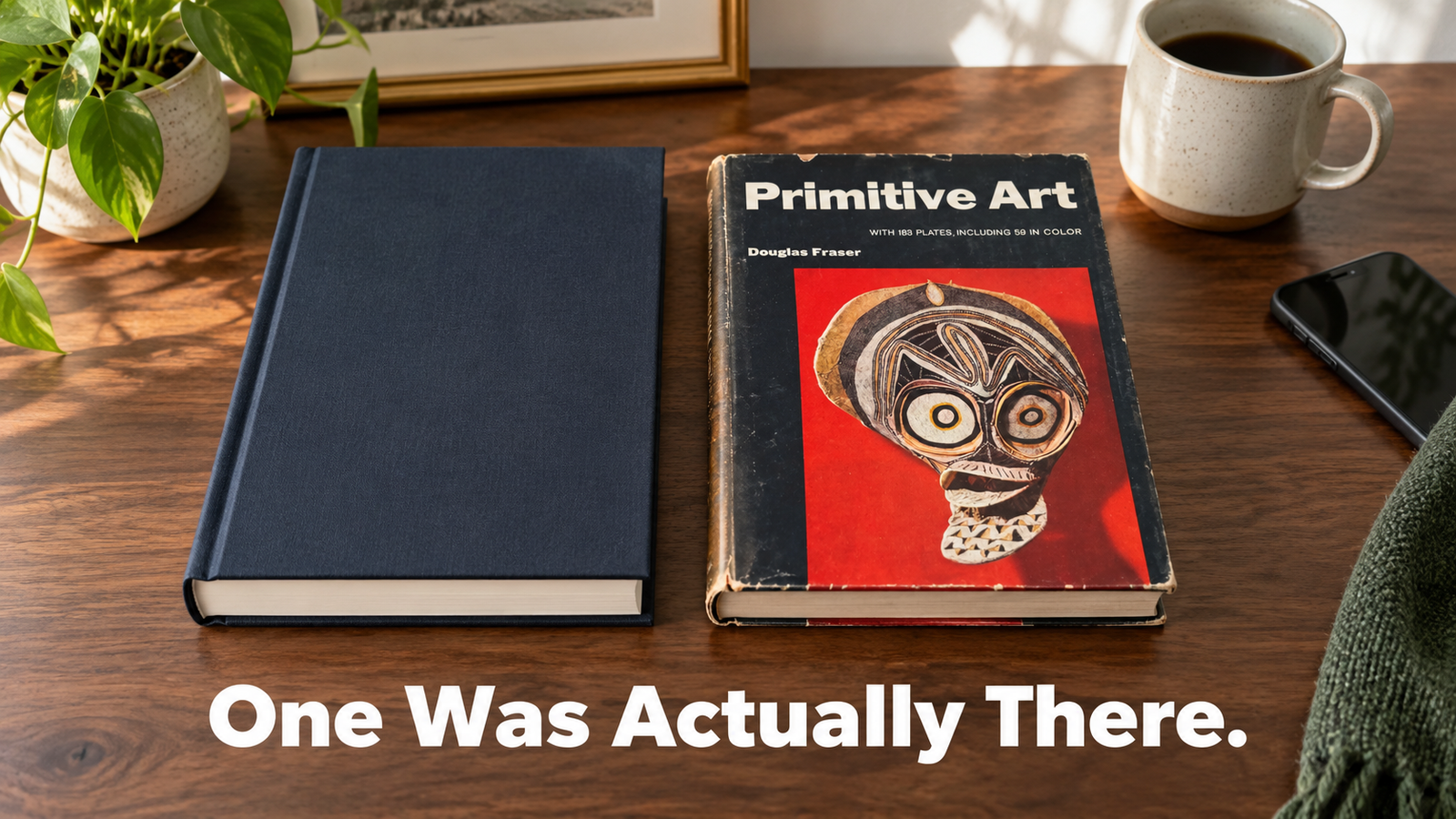 Two hardcover books side by side on a wood table, a modern reprint and an original vintage copy from the same year, shown for comparison