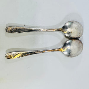 Back view of two 1847 Rogers Bros Daffodil silverplate soup spoons with marks