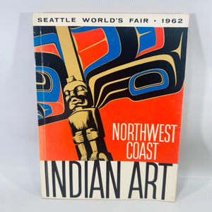 1962 Seattle World’s Fair paperback catalog “Northwest Coast Indian Art” with bold red, blue, and black graphic cover; visible shelfwear to edges.