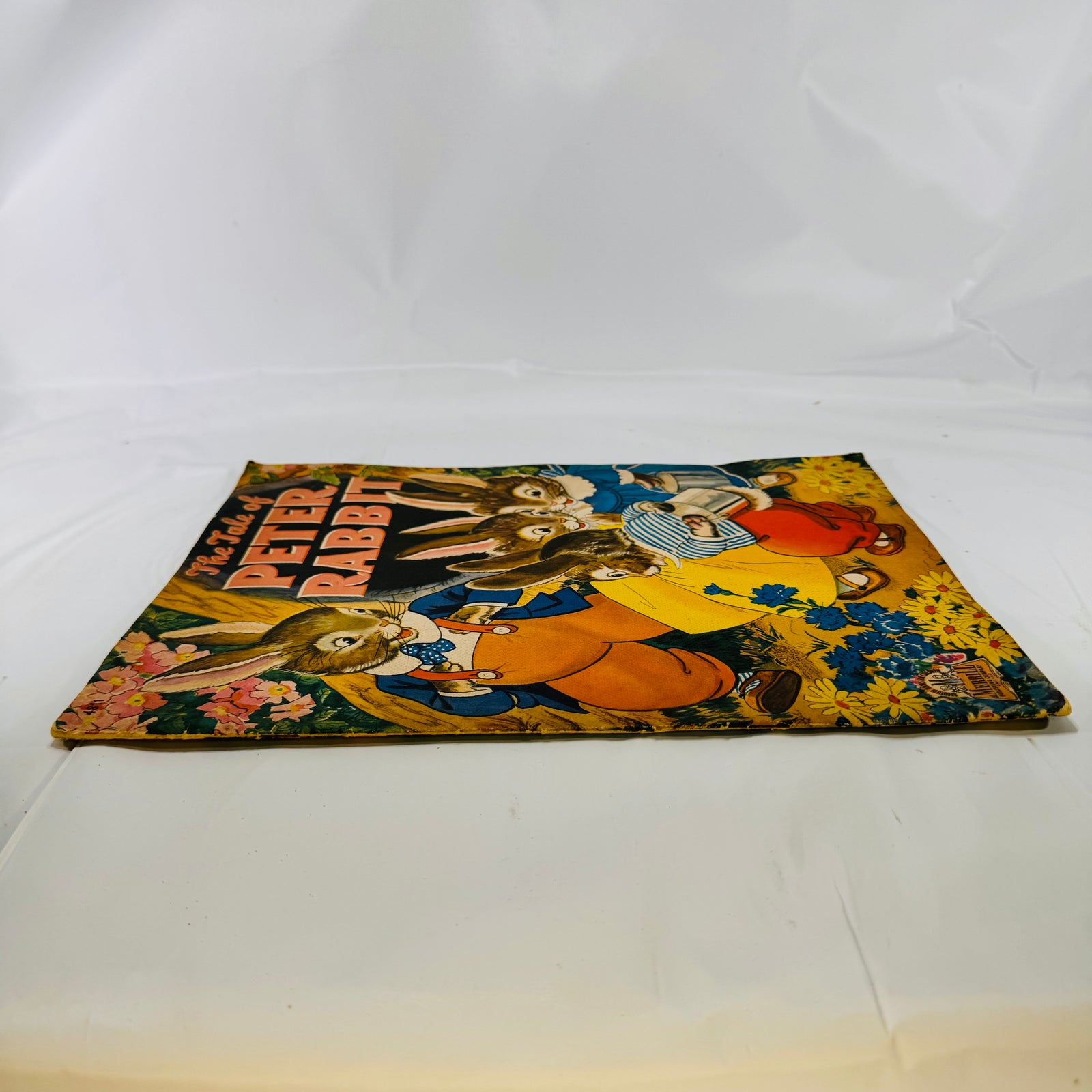 The Tale of Peter Rabbit 1943 shown low and flat, cover edges visible