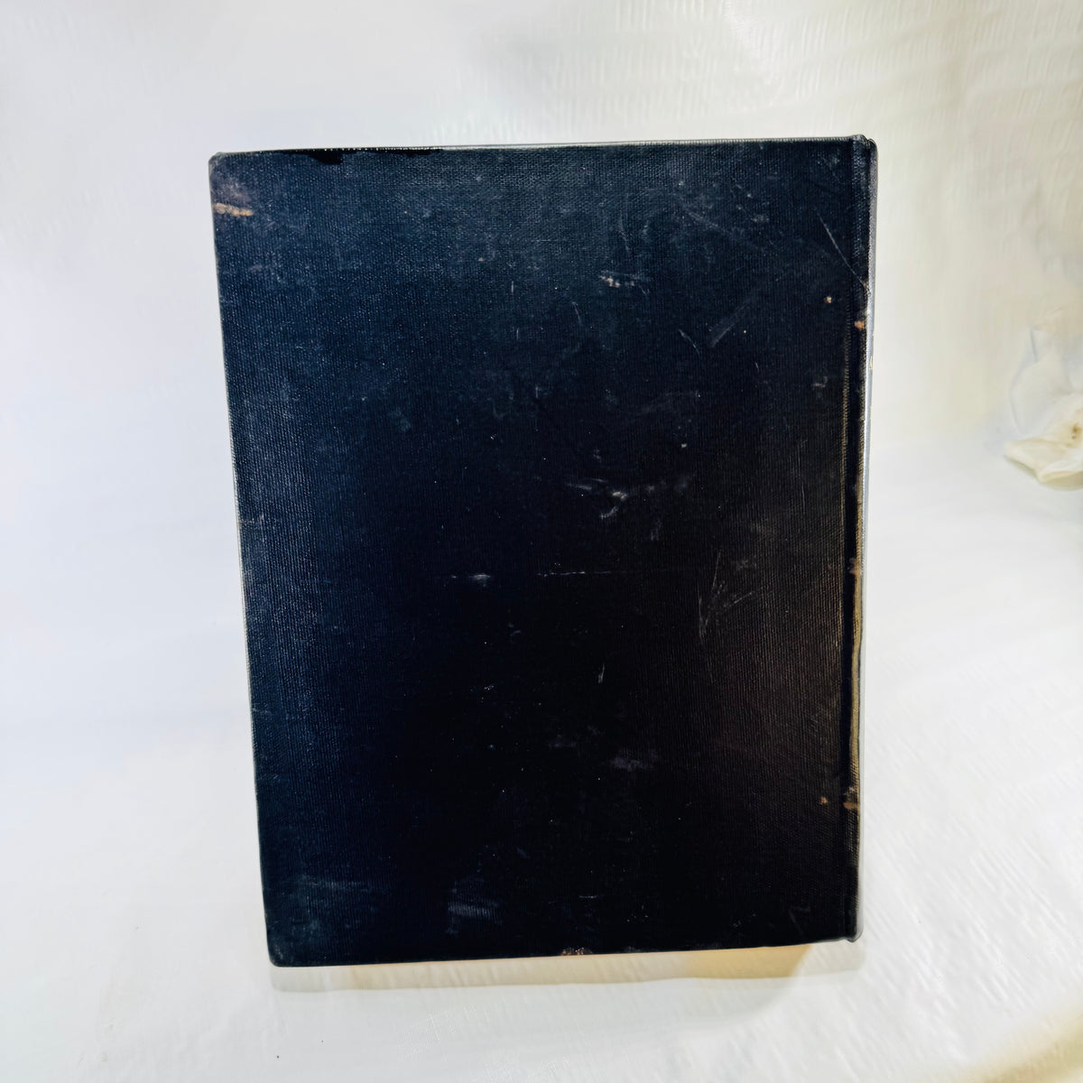 Back cover of the 54th Air Service Group book showing scratches and wear
