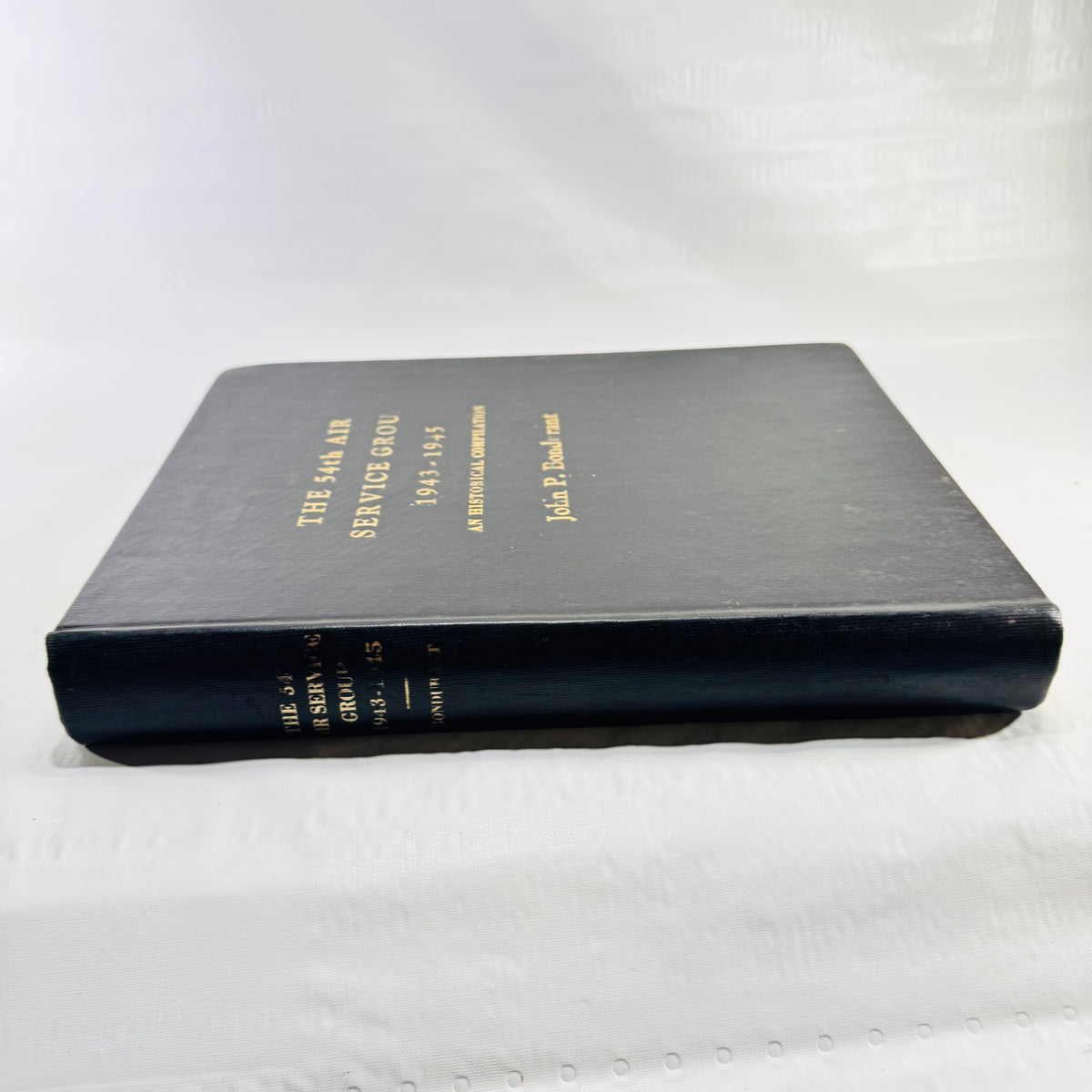 Spine of The 54th Air Service Group 1943-1945 with gilt lettering