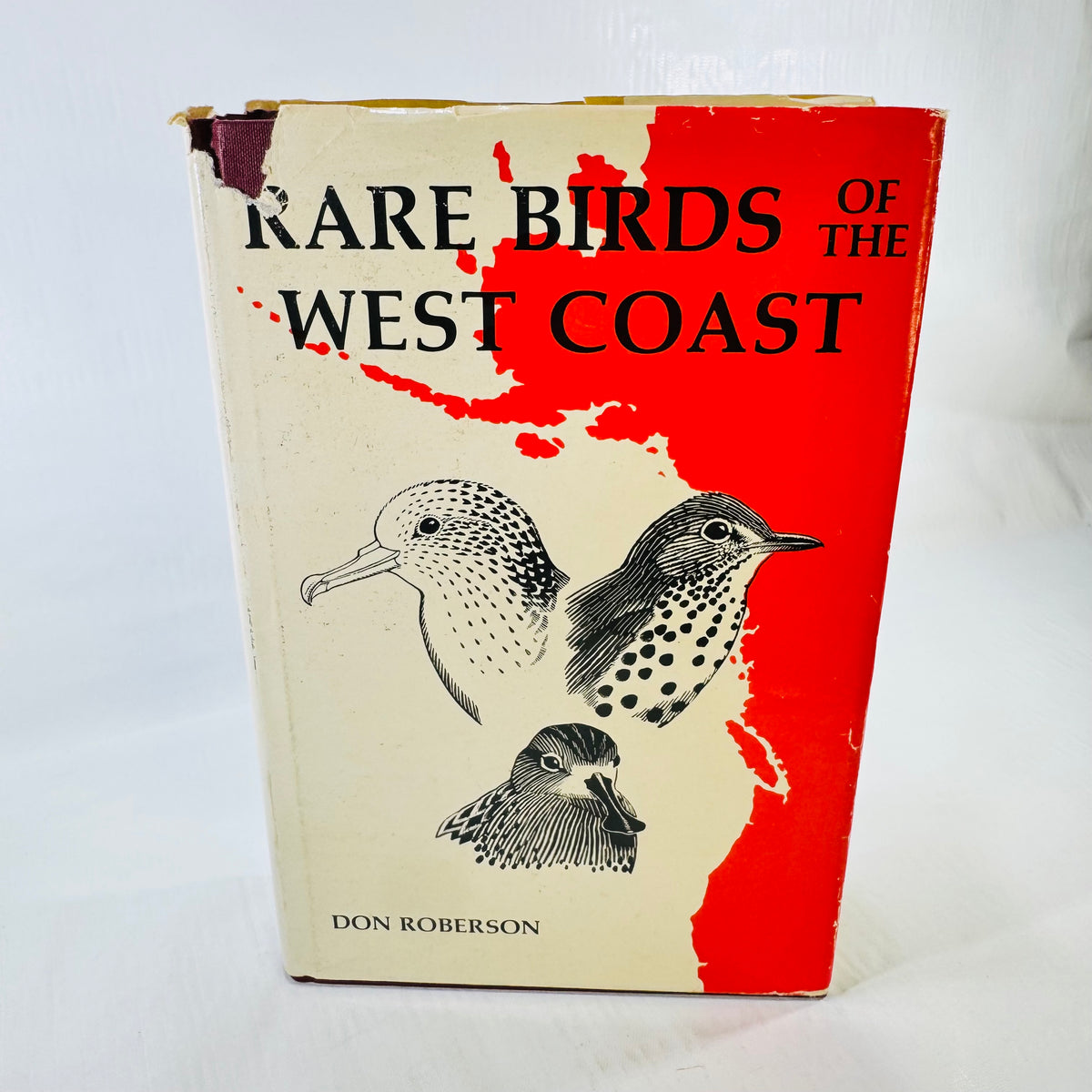 Front dust jacket with missing upper corner and permanent spotting