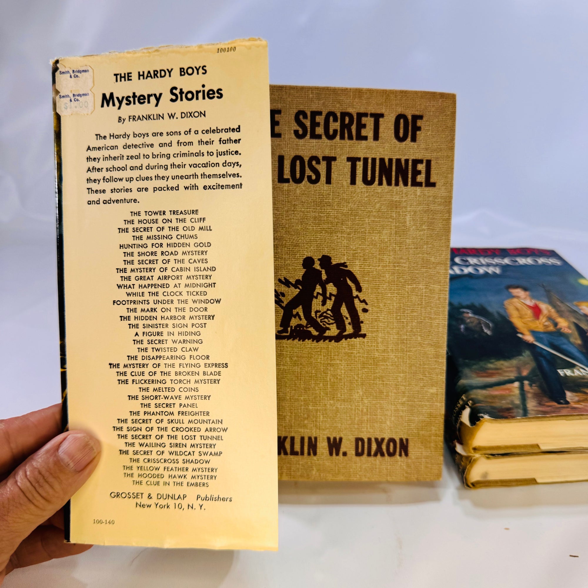 Three Hardy Boys Books by Franklin W. Dixon The Crisscross Shadow The Secret of the Lost Tunnel, The Clue in the Embers Grosset and Dunlap