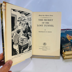 Three Hardy Boys Books by Franklin W. Dixon The Crisscross Shadow The Secret of the Lost Tunnel, The Clue in the Embers Grosset and Dunlap