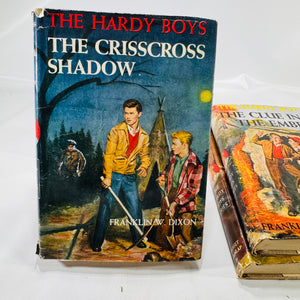 Three Hardy Boys Books by Franklin W. Dixon The Crisscross Shadow The Secret of the Lost Tunnel, The Clue in the Embers Grosset and Dunlap