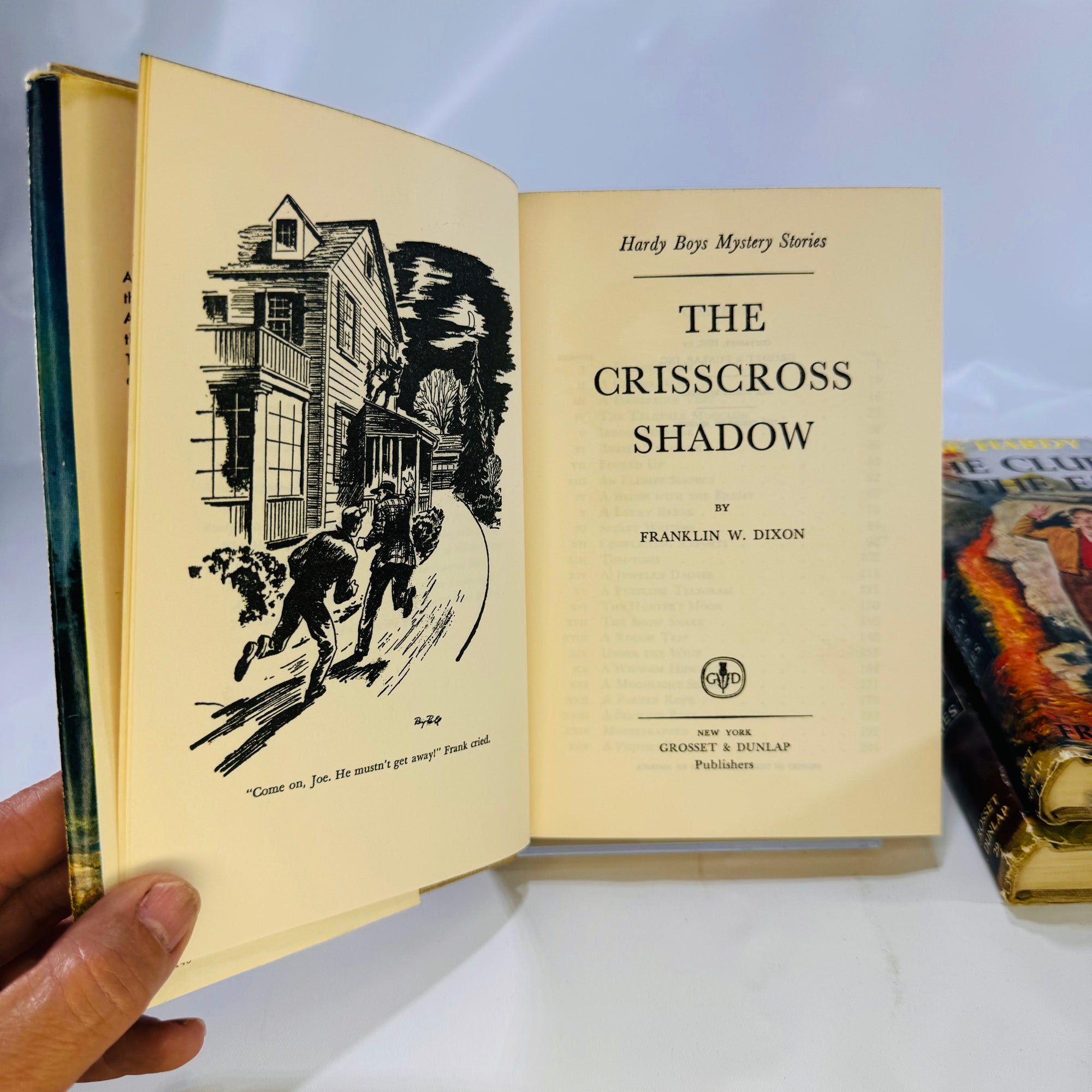 Three Hardy Boys Books by Franklin W. Dixon The Crisscross Shadow The Secret of the Lost Tunnel, The Clue in the Embers Grosset and Dunlap