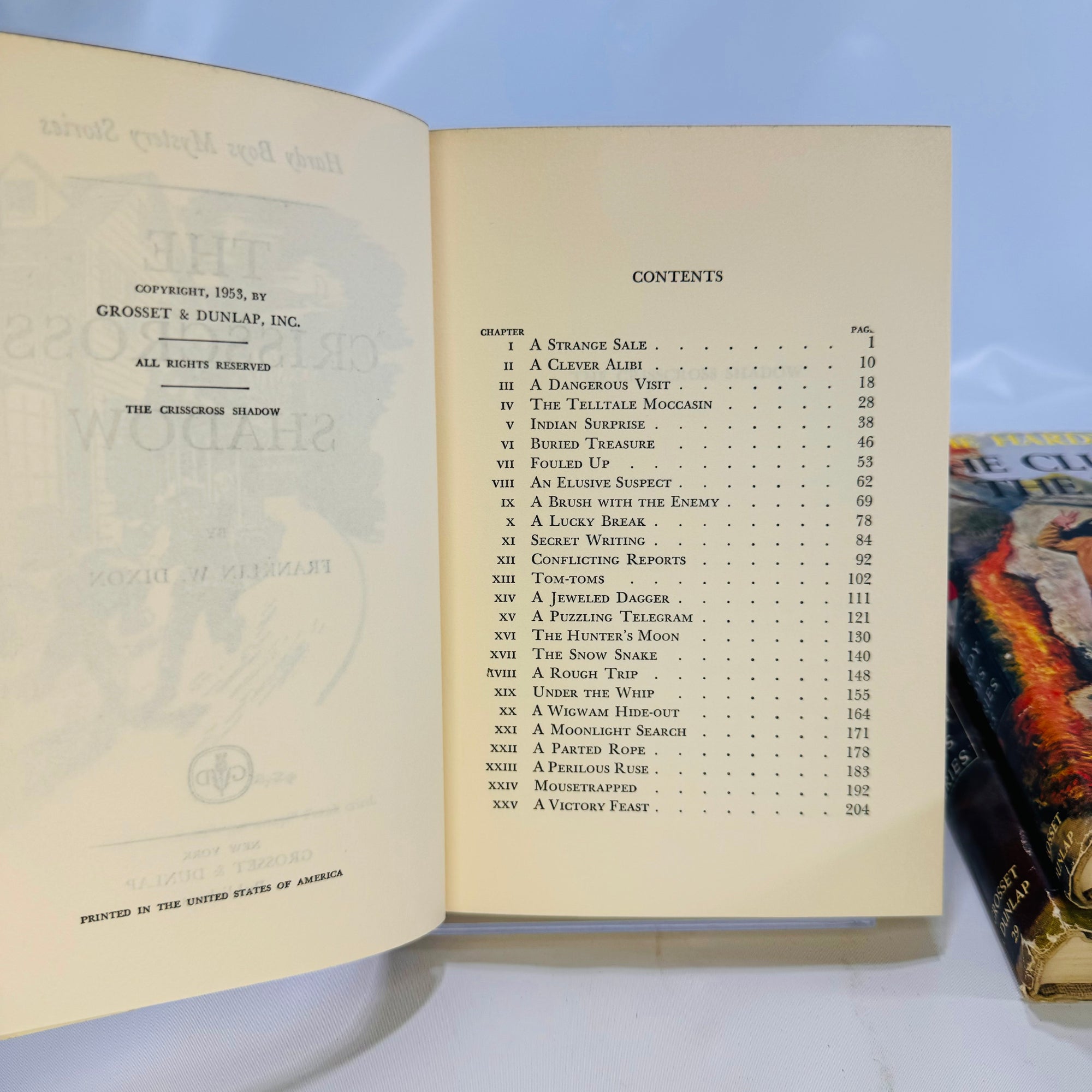 Three Hardy Boys Books by Franklin W. Dixon The Crisscross Shadow The Secret of the Lost Tunnel, The Clue in the Embers Grosset and Dunlap