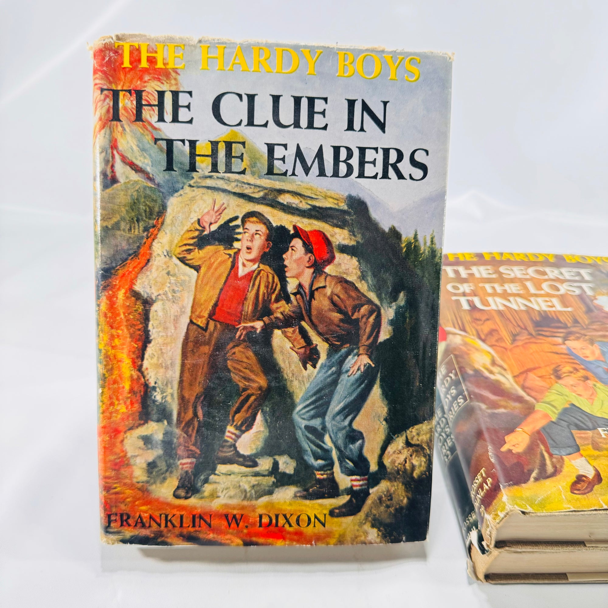 Three Hardy Boys Books by Franklin W. Dixon The Crisscross Shadow The Secret of the Lost Tunnel, The Clue in the Embers Grosset and Dunlap