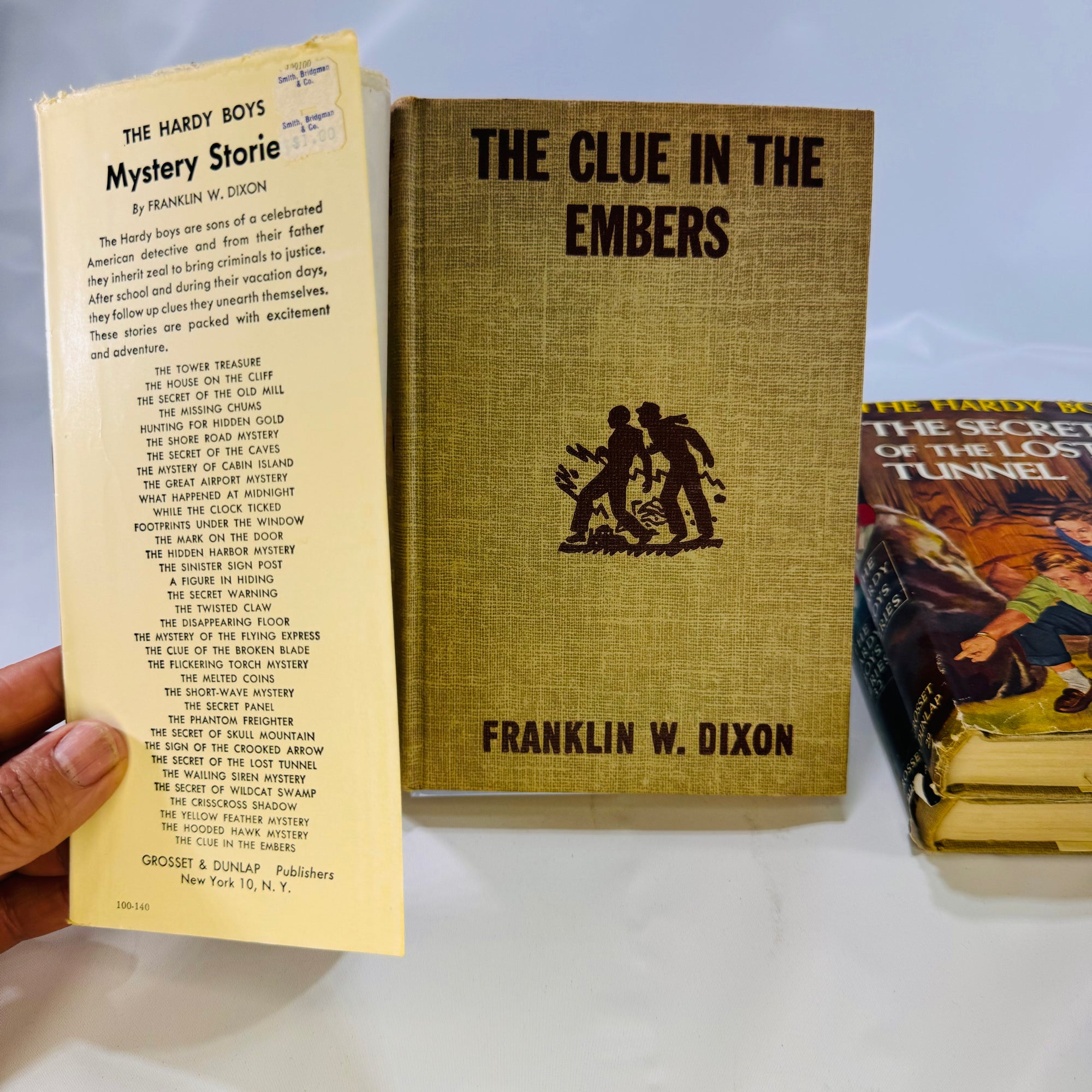 Three Hardy Boys Books by Franklin W. Dixon The Crisscross Shadow The Secret of the Lost Tunnel, The Clue in the Embers Grosset and Dunlap