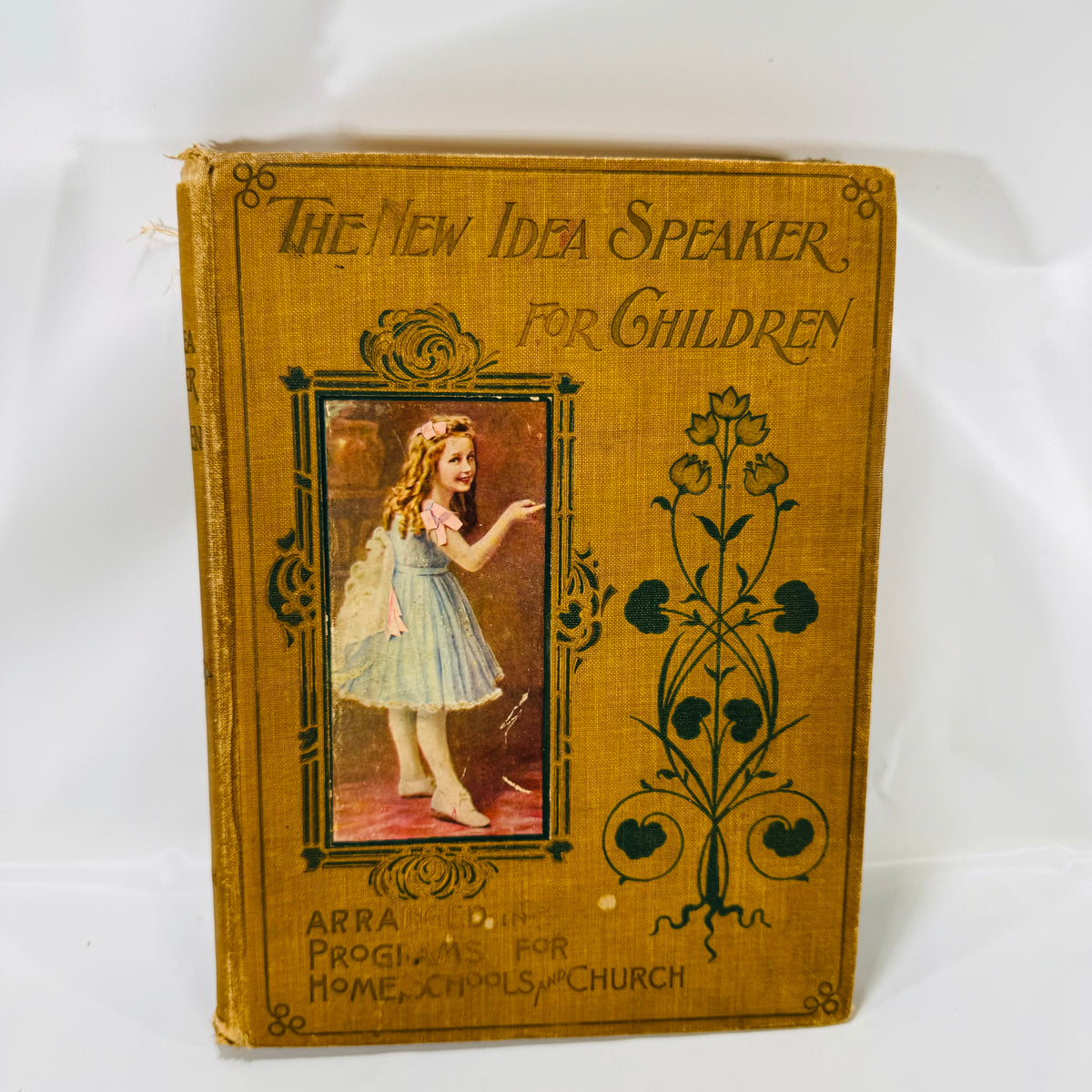 The New Idea Speaker for Children 1902, front cover with a pasted color picture