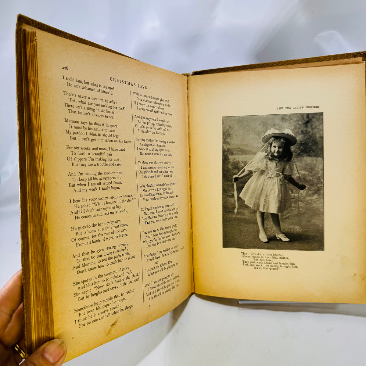Christmas pages with a half-tone photo of a child, The New Idea Speaker 1902