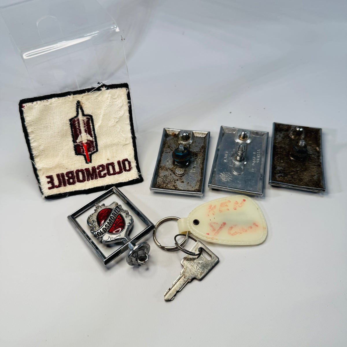 Vintage Oldsmobile Memorabilia Bundle – Patch, Keychain & Emblems Lot