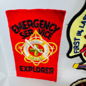 Red patch with 'Emergency Service Explorer' text and emblem on a white background