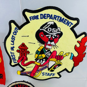 Fire department patch with cartoon character and text on a white background