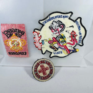 Three embroidered patches on a white background