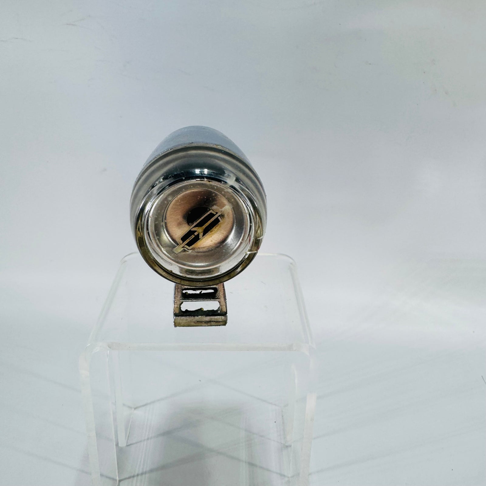 Vintage chrome Oldsmobile outside door thermometer gauge with black dial and clear lens, drum-style accessory part.