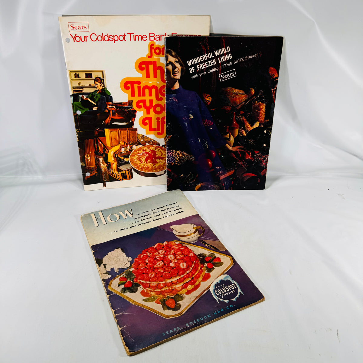 Three Sears Coldspot freezer manuals, 1950s and 1960s, covers together
