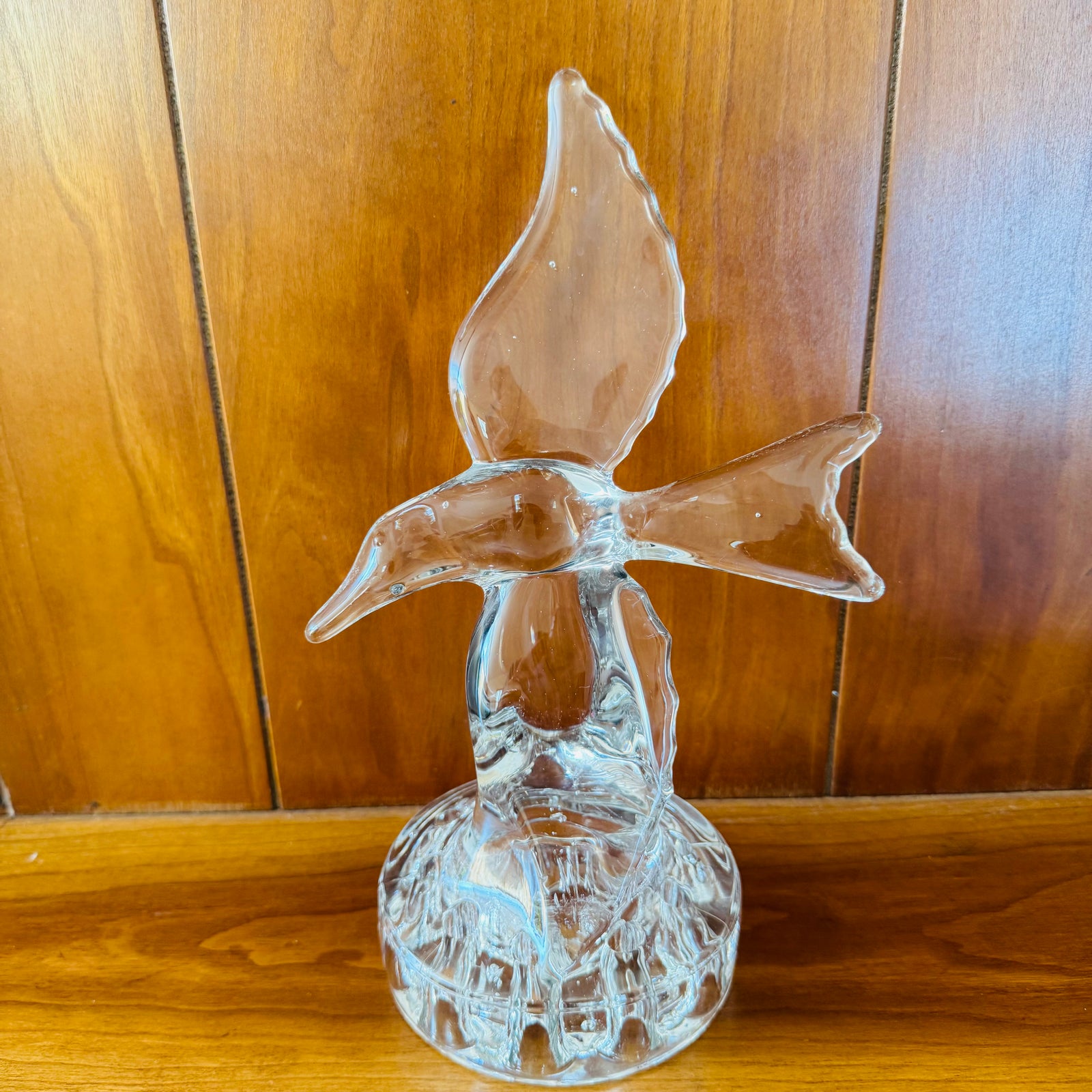 Clear vintage Cambridge crystal seagull flower frog with wings raised, perched on a clear 10-hole flower-arranging base