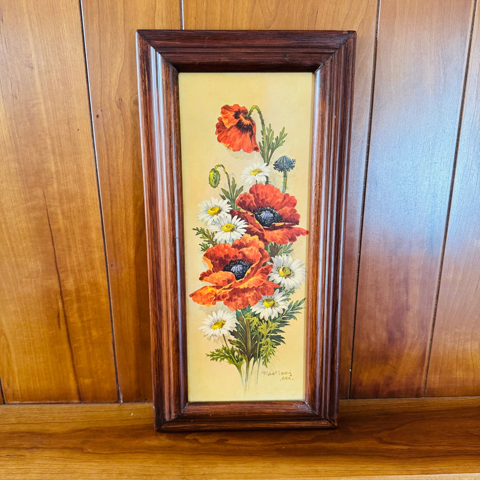 Vintage framed floral wall art with red poppies and white daisies on a golden yellow background in a dark wood frame, vertical 18x9.