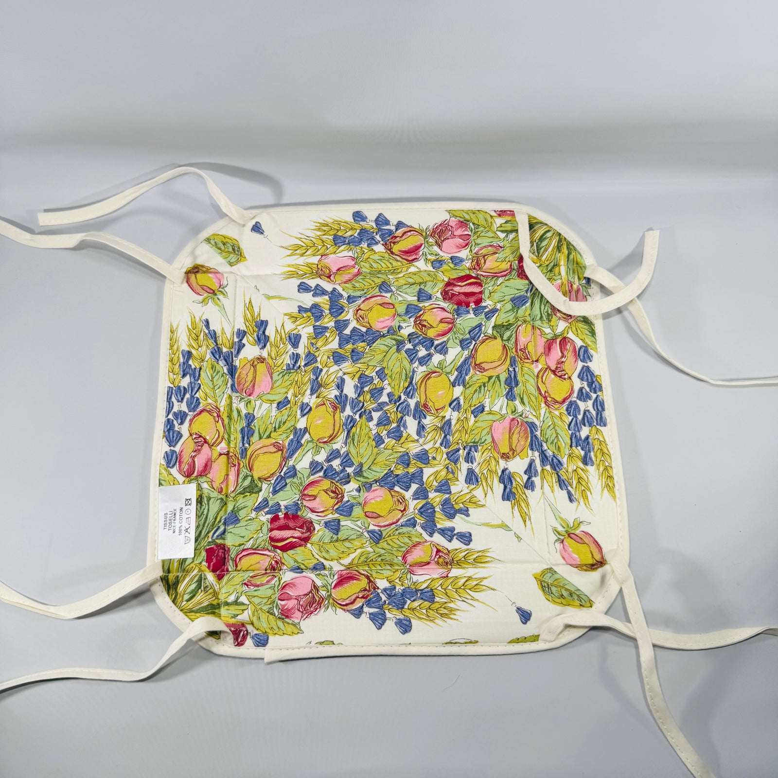 Square Tissus Toselli French Provencal bread basket in Rose & Lavender (Rose Lavande) floral print, laid flat with corner ties on a white background.