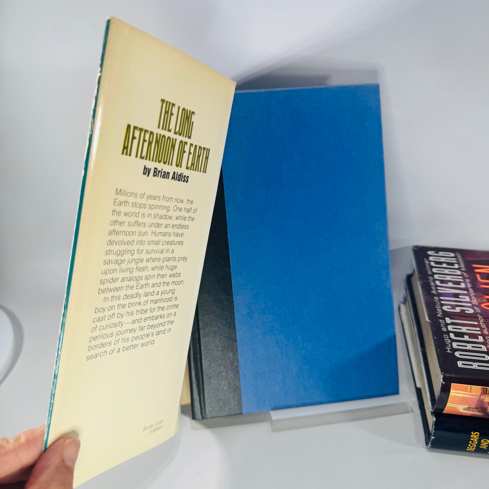 Three books titled 'The Long Afternoon of Earth', 'Beggars and Choosers', and 'The Alien Years'  