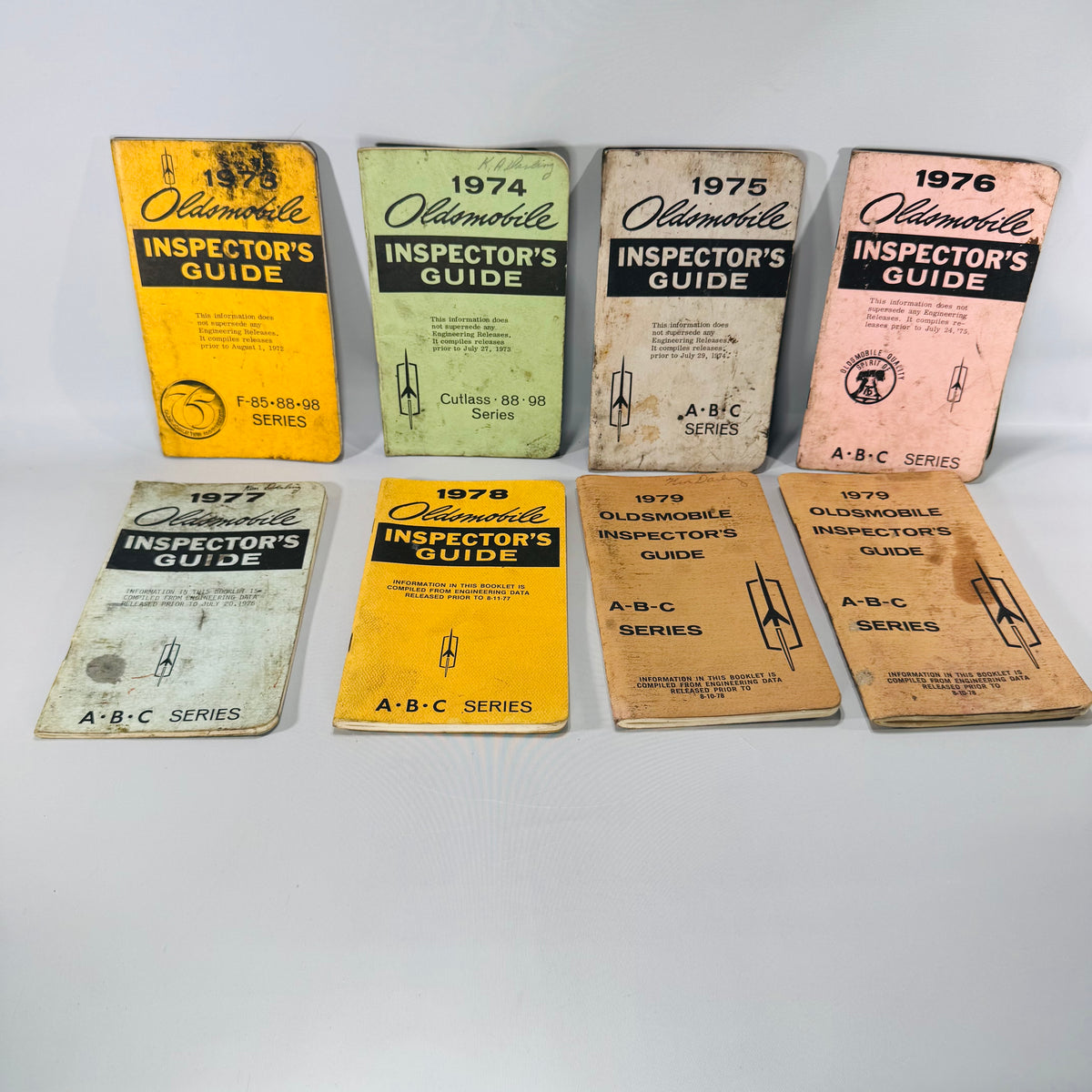 Vintage Oldsmobile Inspector’s Guide Lot (1973–1979) — 8 Pocket Manuals, Codes & Specs (Cutlass / 88 / 98 / F-85 / A-B-C)